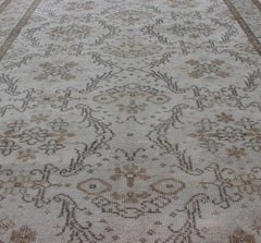 Vintage Turkish Oushak Carpet with Ivory Ground and Repeating Floral Design