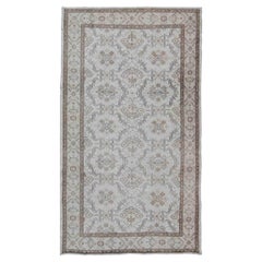 Vintage Turkish Oushak Carpet with Ivory Ground and Repeating Floral Design