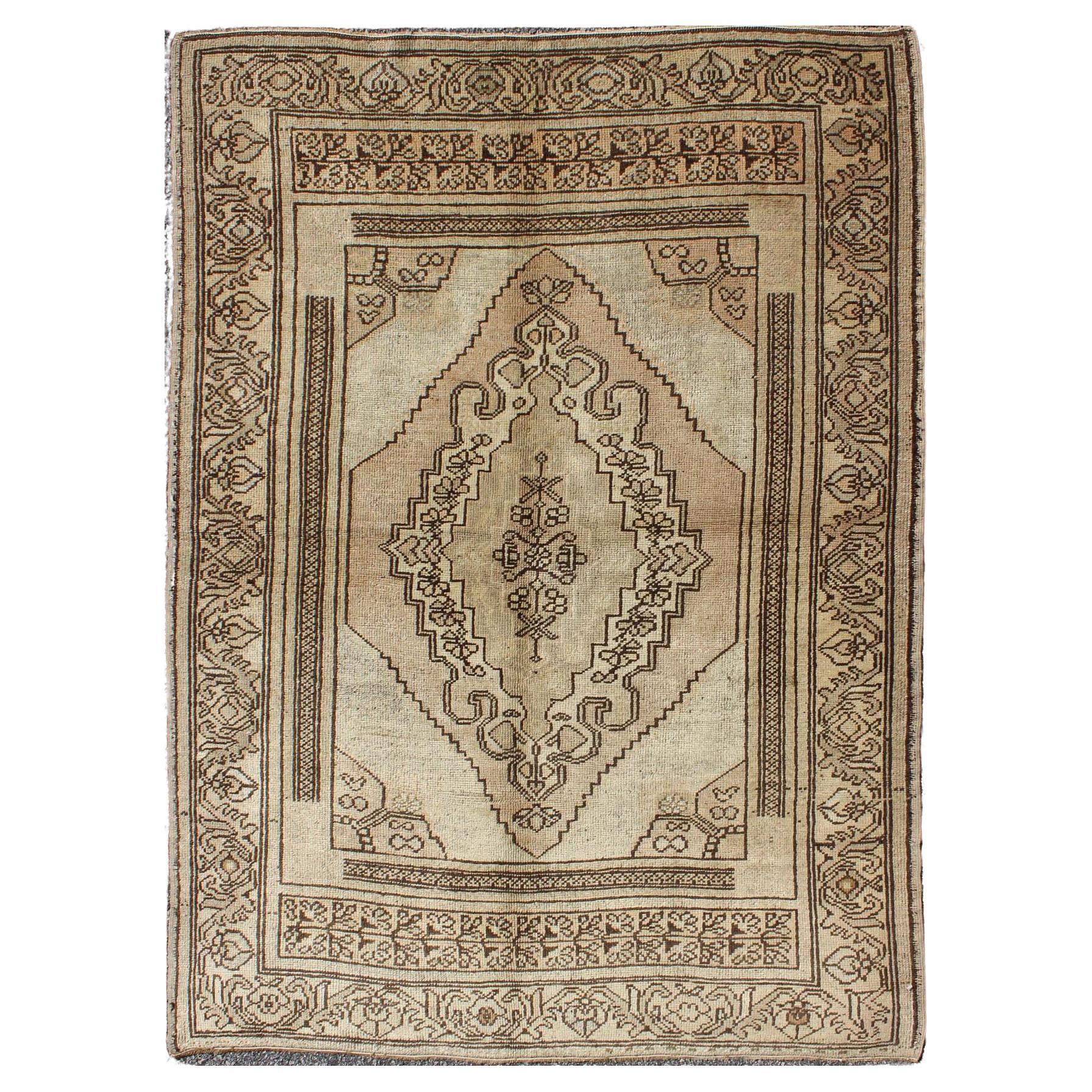 Vintage Turkish Oushak Carpet with Stylized Design in Brown, Cream, and Tan For Sale