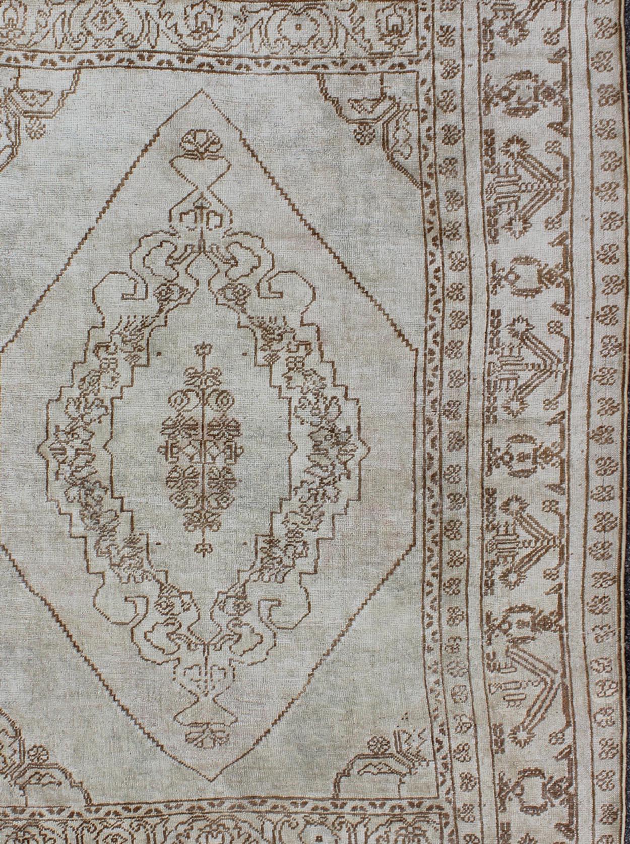 Hand-Knotted Vintage Turkish Oushak Carpet with Floral Medallion Design in Neutral Tones For Sale