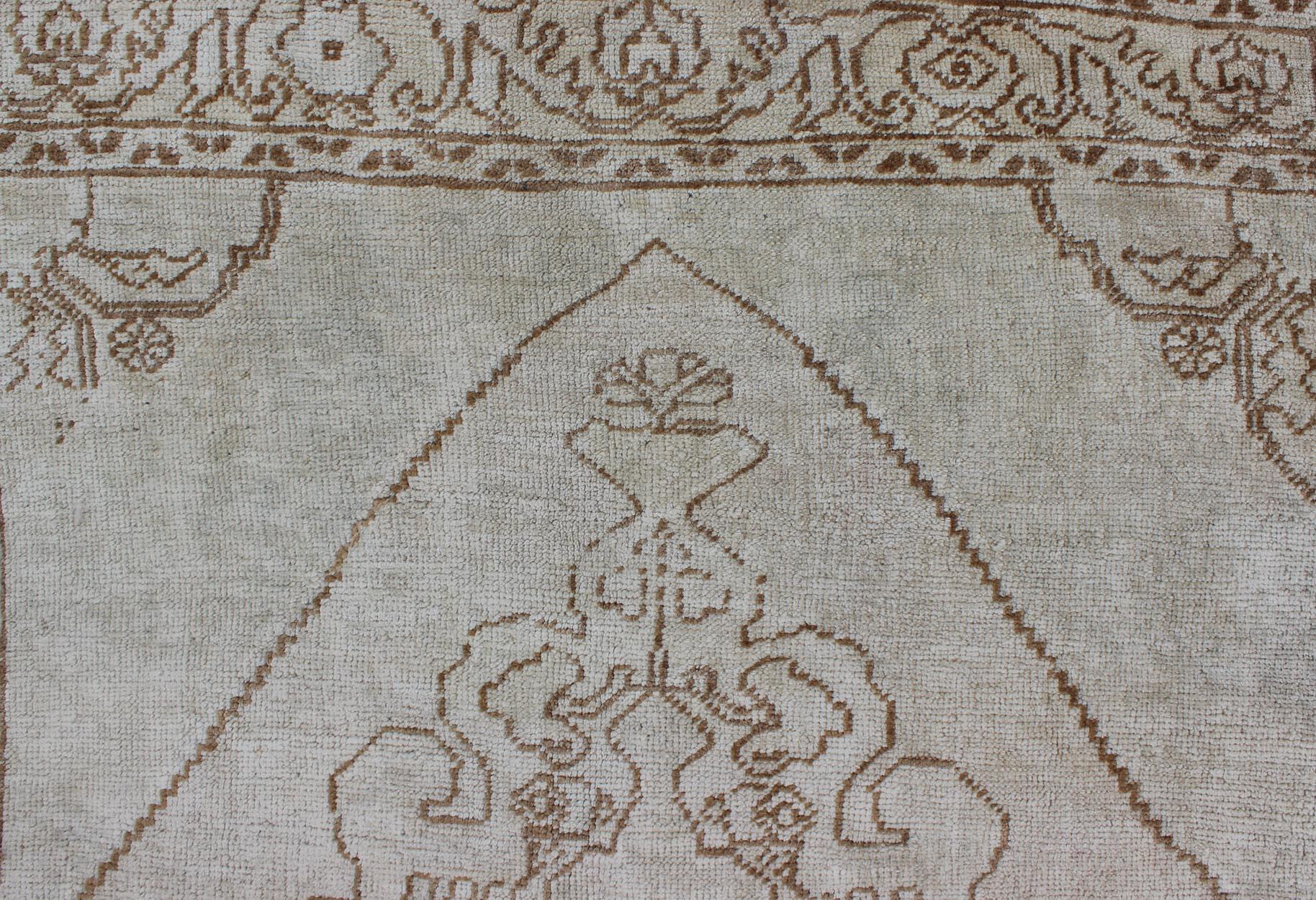Wool Vintage Turkish Oushak Carpet with Floral Medallion Design in Neutral Tones For Sale