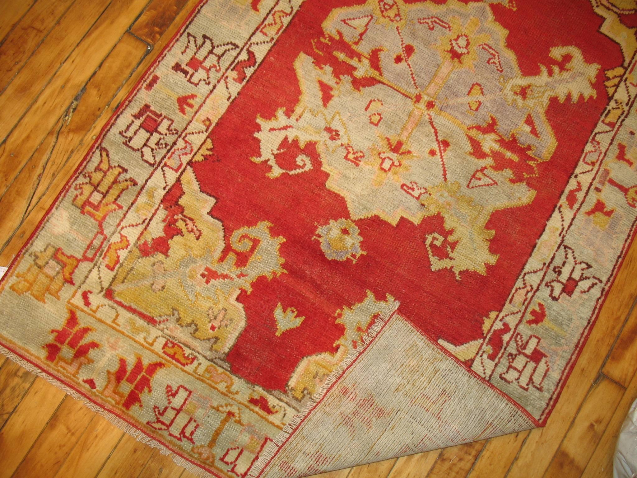 A brightly colored vintage Turkish Oushak rug.