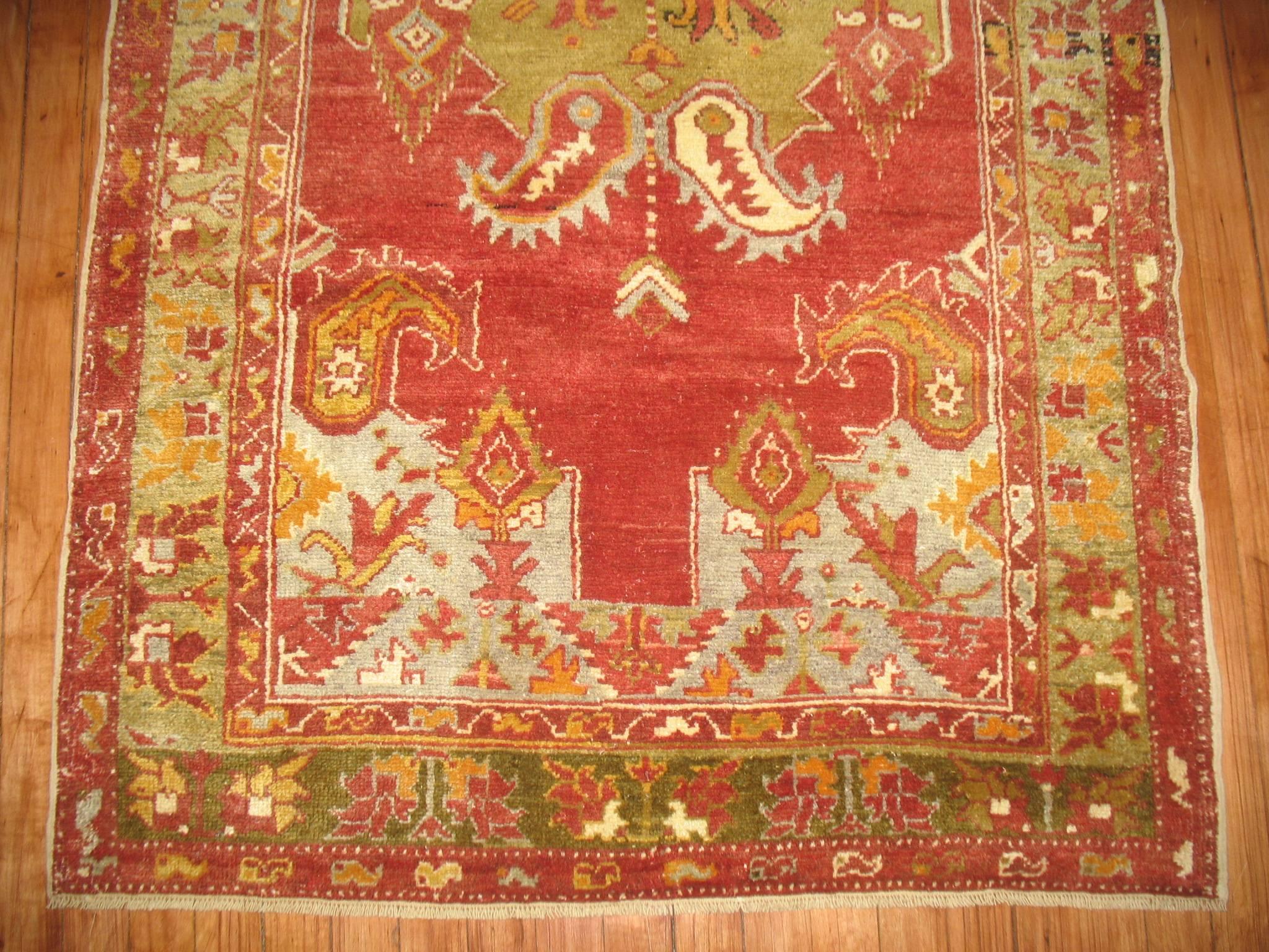 A one of a kind vintage Turkish Oushak decorative throw rug.