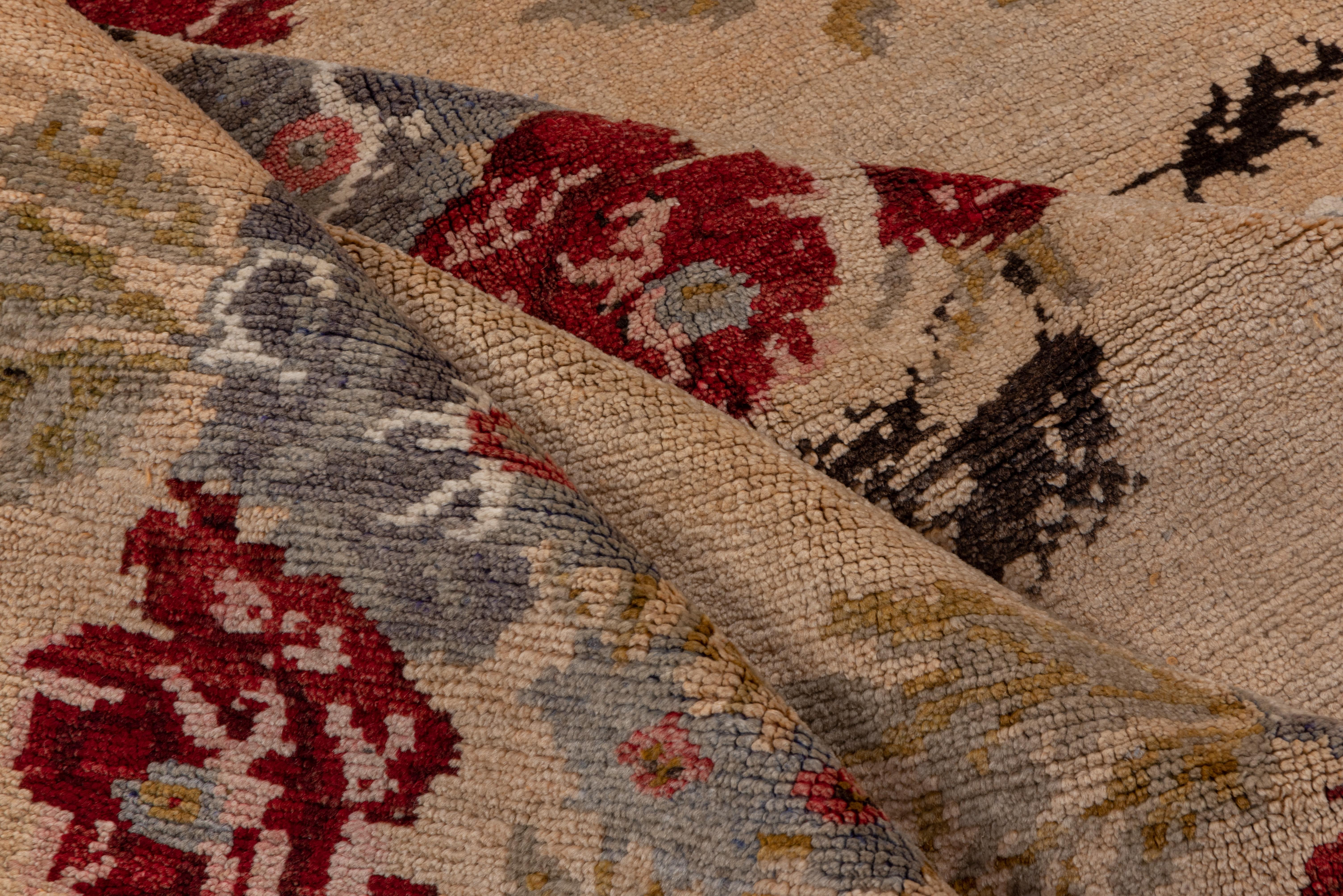 A charming gallery carpet! This attractive rustic long rug shows three columns of six flower and leaf bouquets in an Ottoman embroidery style, accented in red and teal, Good on a cream ground. Narrowest of string borders. Good condition.
 