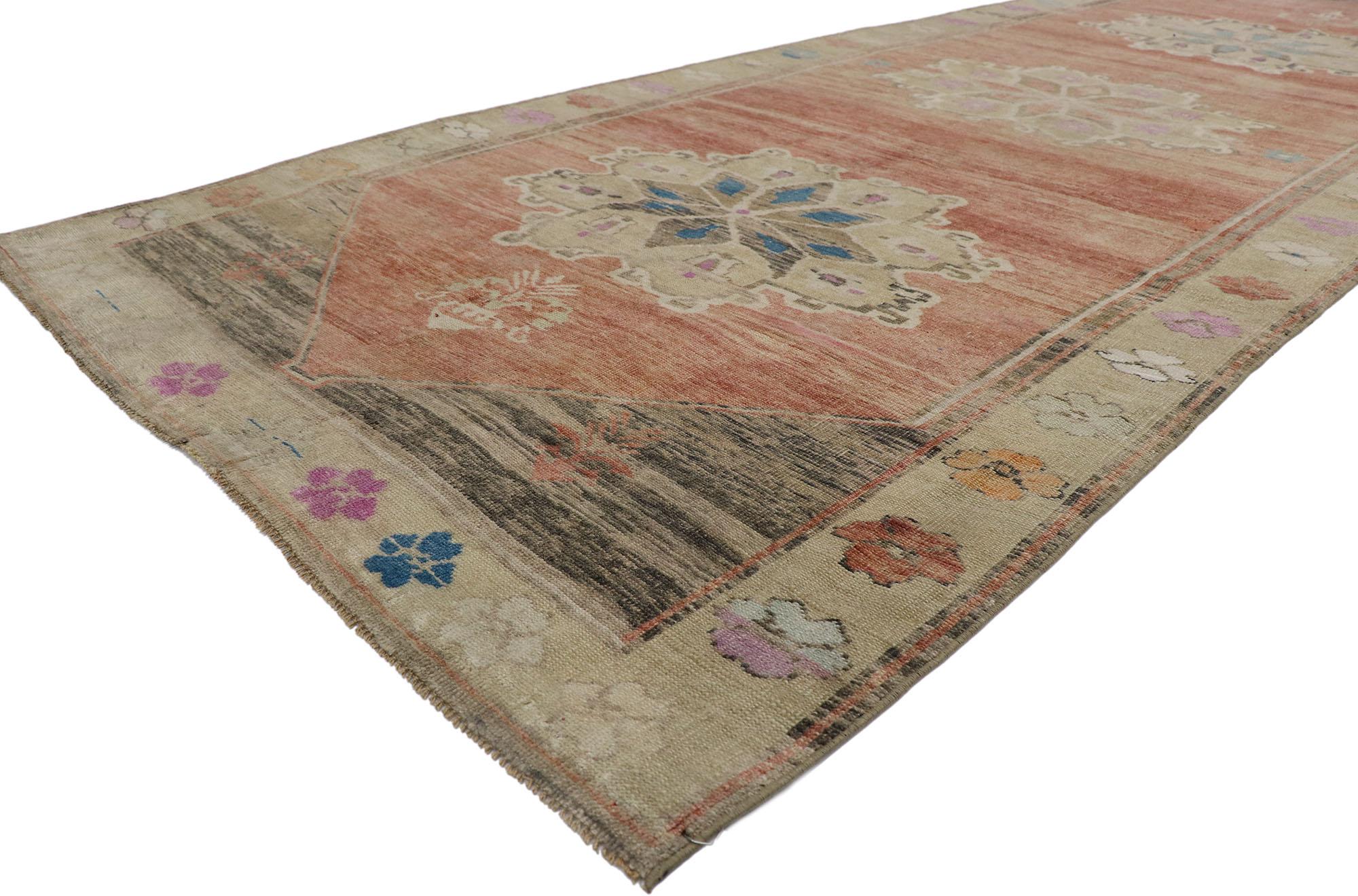 53578 Vintage Turkish Oushak gallery rug 04'09 x 12'02. Full of tiny details combined with beguiling beauty, this hand-knotted wool vintage Turkish Oushak gallery rug is a captivating vision of woven beauty. The abrashed brick red field features