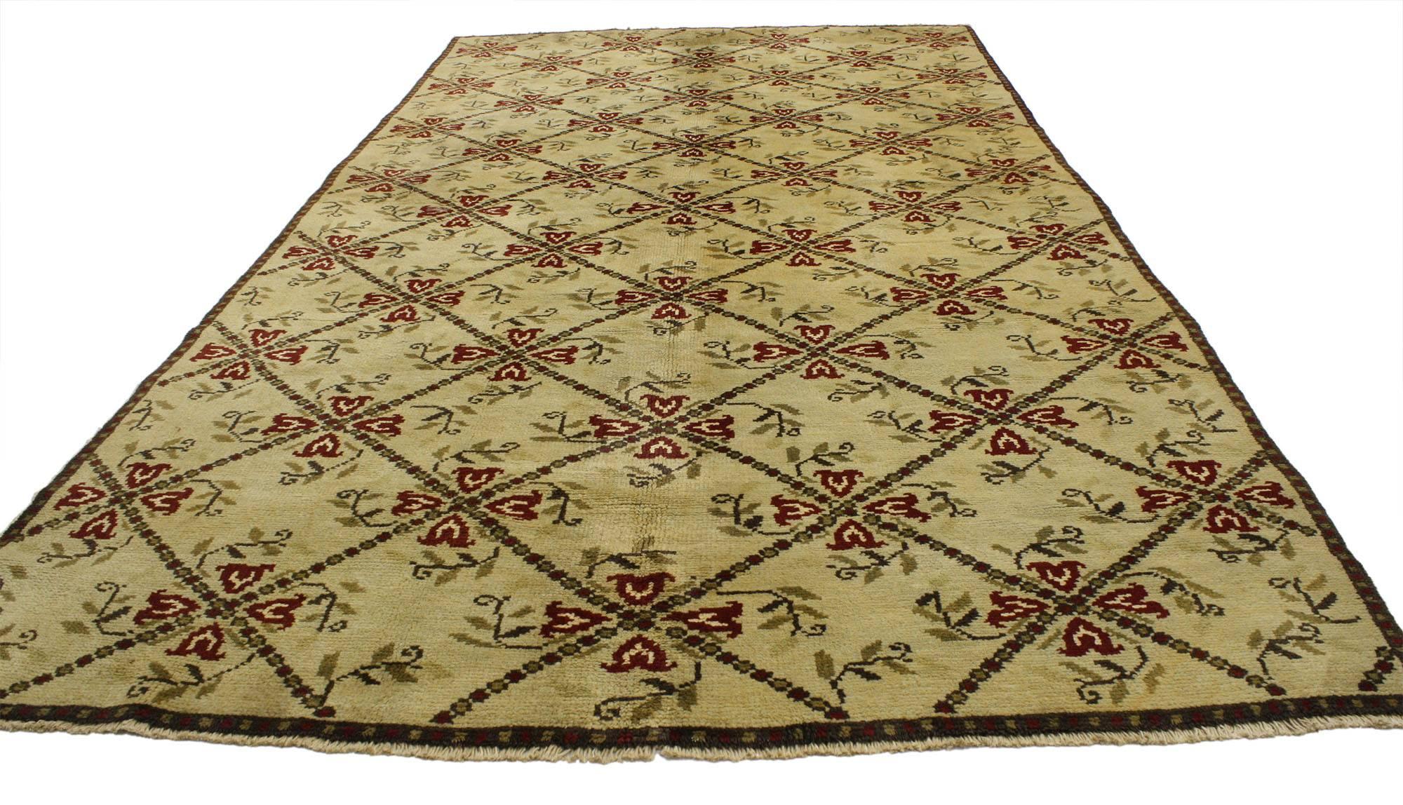 52144, vintage Turkish Oushak gallery rug, wide hallway runner. This hand-knotted wool vintage Turkish Oushak gallery rug features an all-over floral lattice motif on an abrashed beige field. A simple gridded border frames the design, repeating the