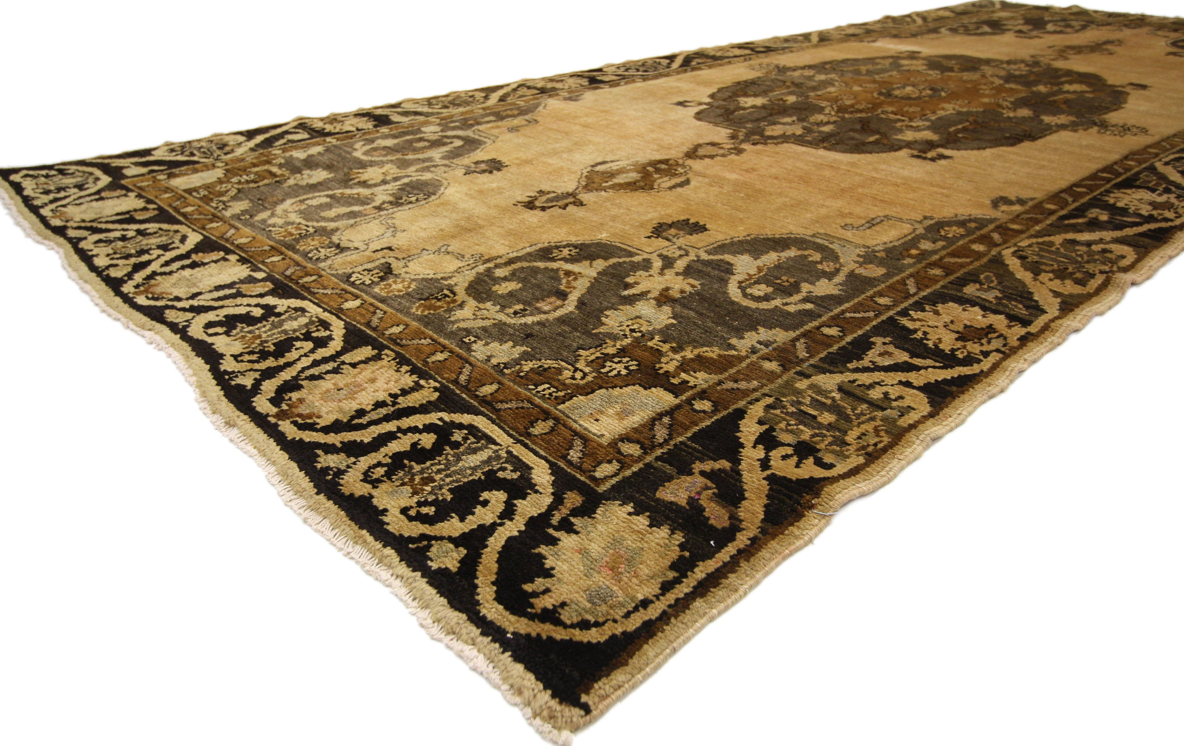 50033 Vintage Turkish Oushak Gallery Rug, Wide Hallway Runner with Modern Style. Full of character and stately presence, this vintage Kars gallery rug showcases an extravagant geometric design. Rendered in beautiful variegated earth tone shades of