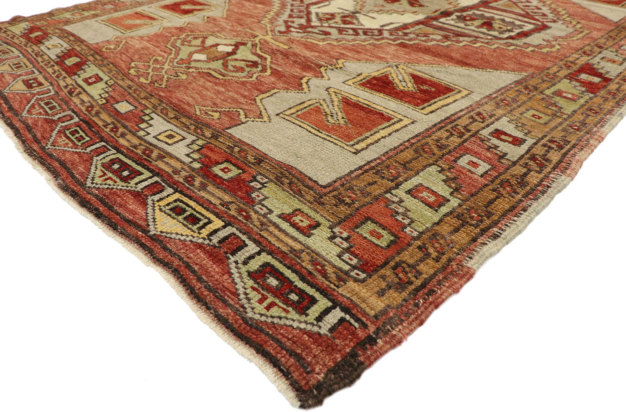 51799, vintage Turkish Oushak Gallery rug with Craftsman style, wide hallway runner. This hand knotted wool vintage Turkish Oushak gallery rug features two stepped hexagonal medallions with anchor pendants floating on an abrashed brick red field.