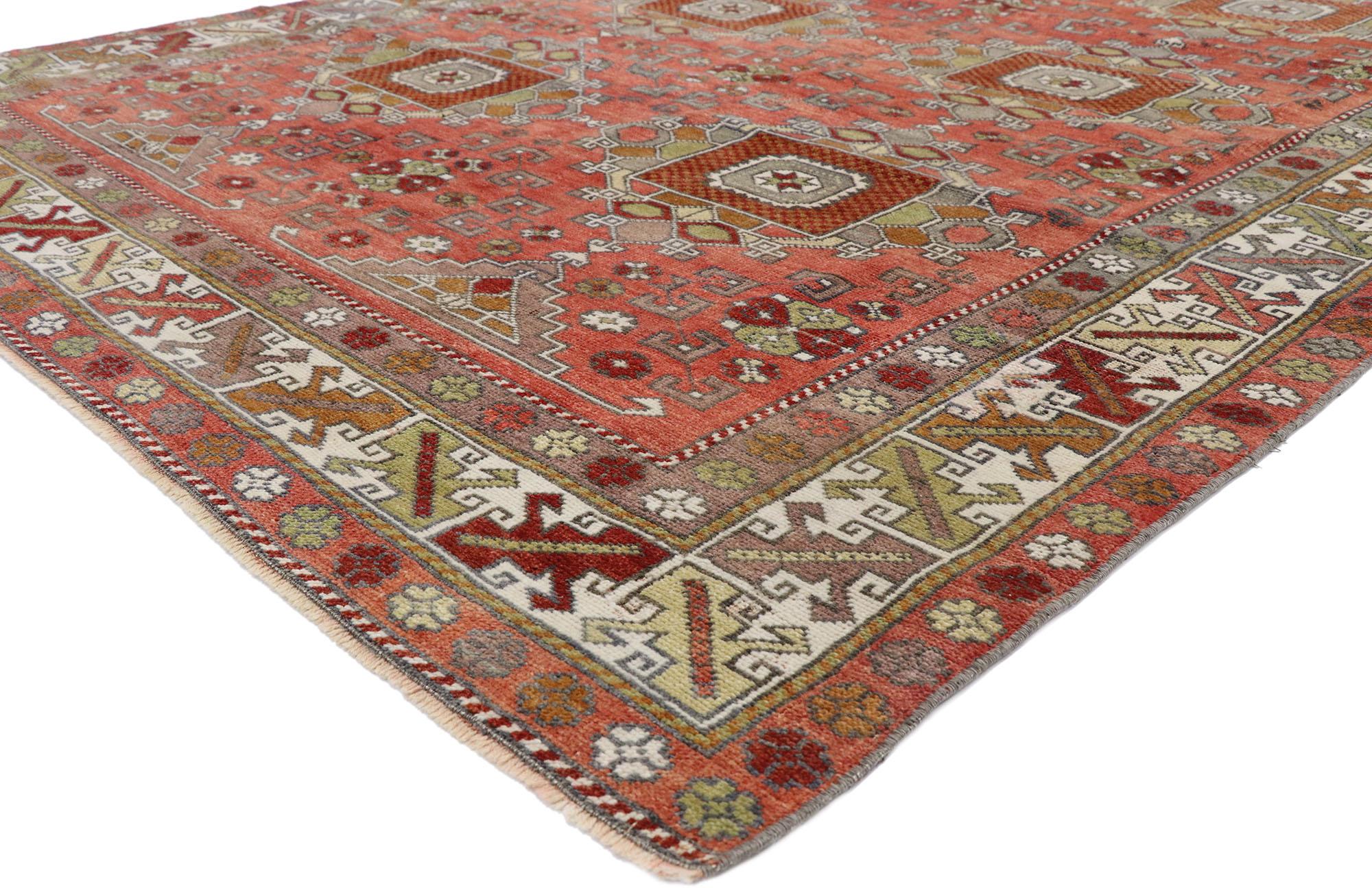 52751 vintage Turkish Oushak Gallery rug. Displaying balanced symmetry and bold geometric shapes, this hand knotted wool vintage Turkish Oushak gallery rug embodies tribal style with rectilinear design elements from the past. Two vertical columns of