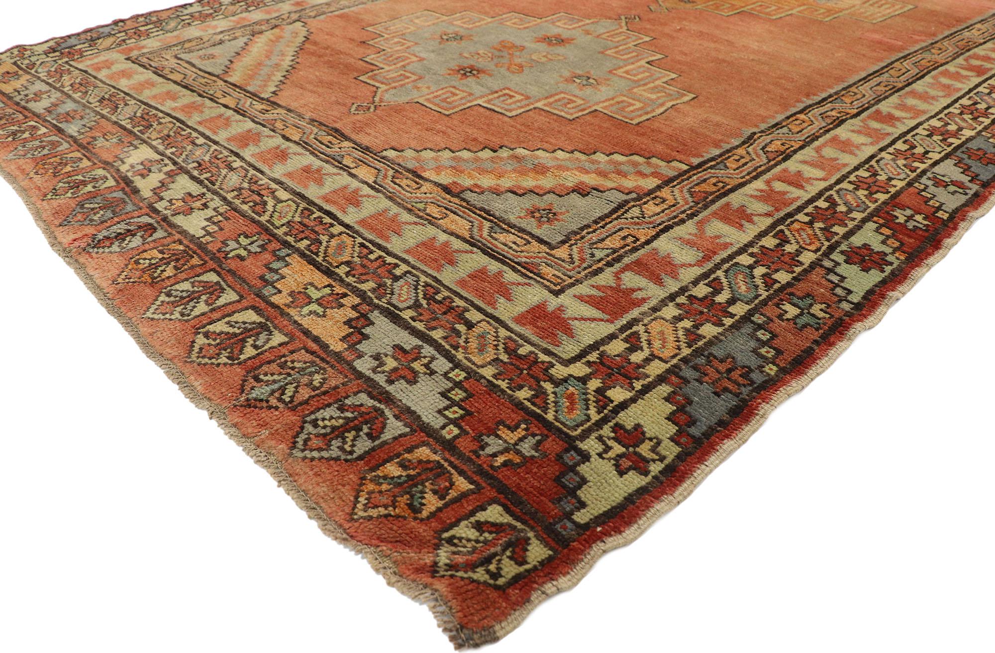 51802, vintage Turkish Oushak gallery rug with Spanish mission style, wide hallway runner. This hand knotted wool vintage Turkish Oushak gallery rug features three large stepped medallions with small diamond pendants floating on an abrashed terra