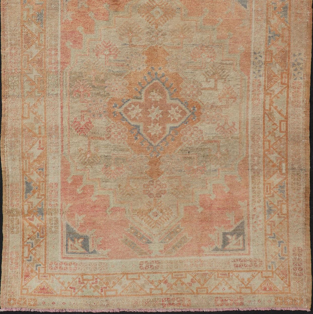 20th Century Vintage Turkish Oushak Gallery Rug with Tribal Medallion Design Variegated Red For Sale