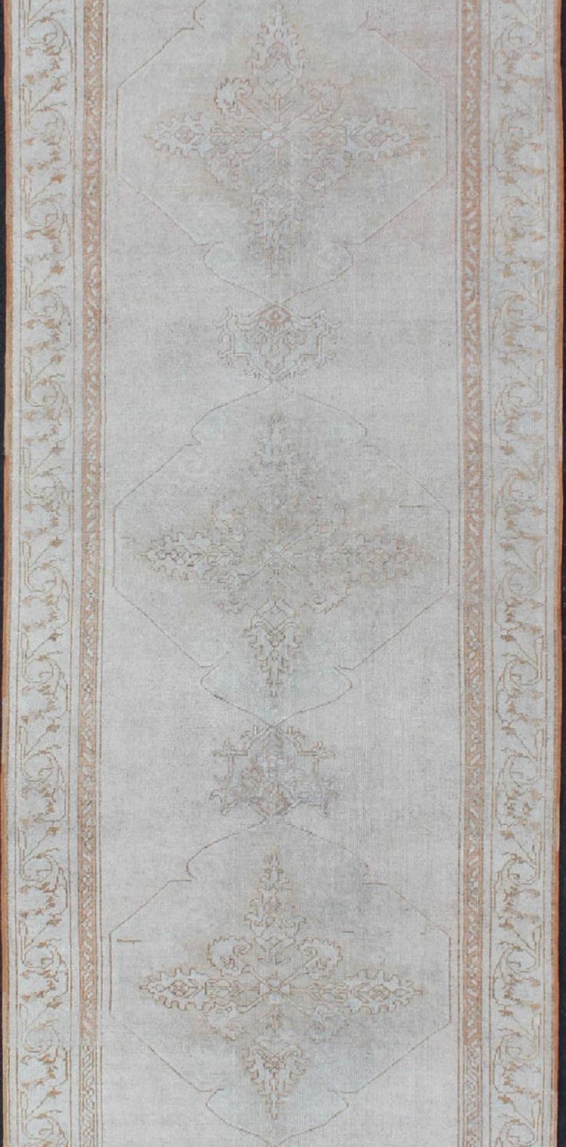 Hand-Knotted Vintage Turkish Oushak Gallery Runner with Medallions in Muted Tones For Sale