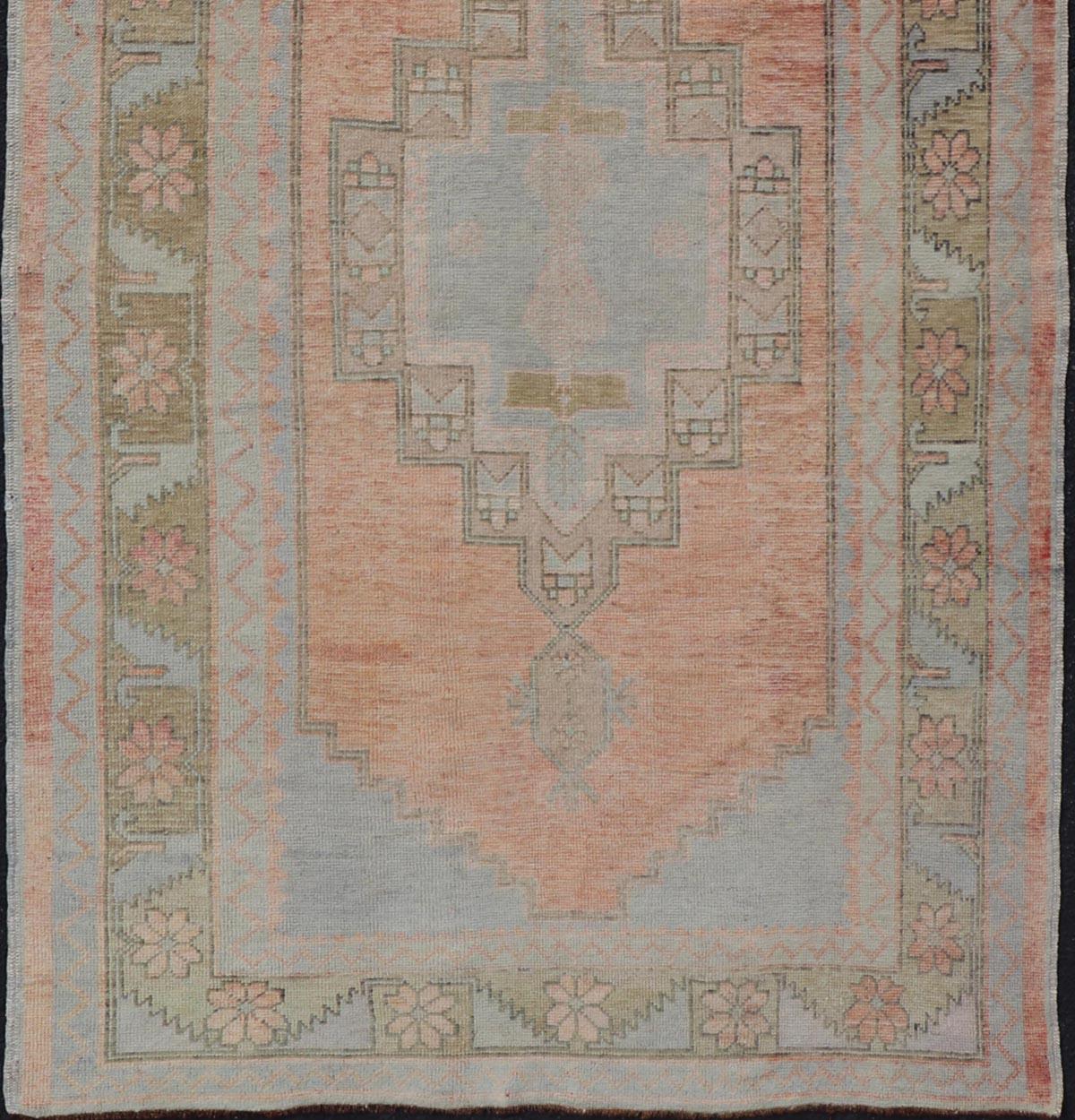 Wool Vintage Turkish Oushak Gallery with Tribal Medallions in Soft Peach and Green For Sale