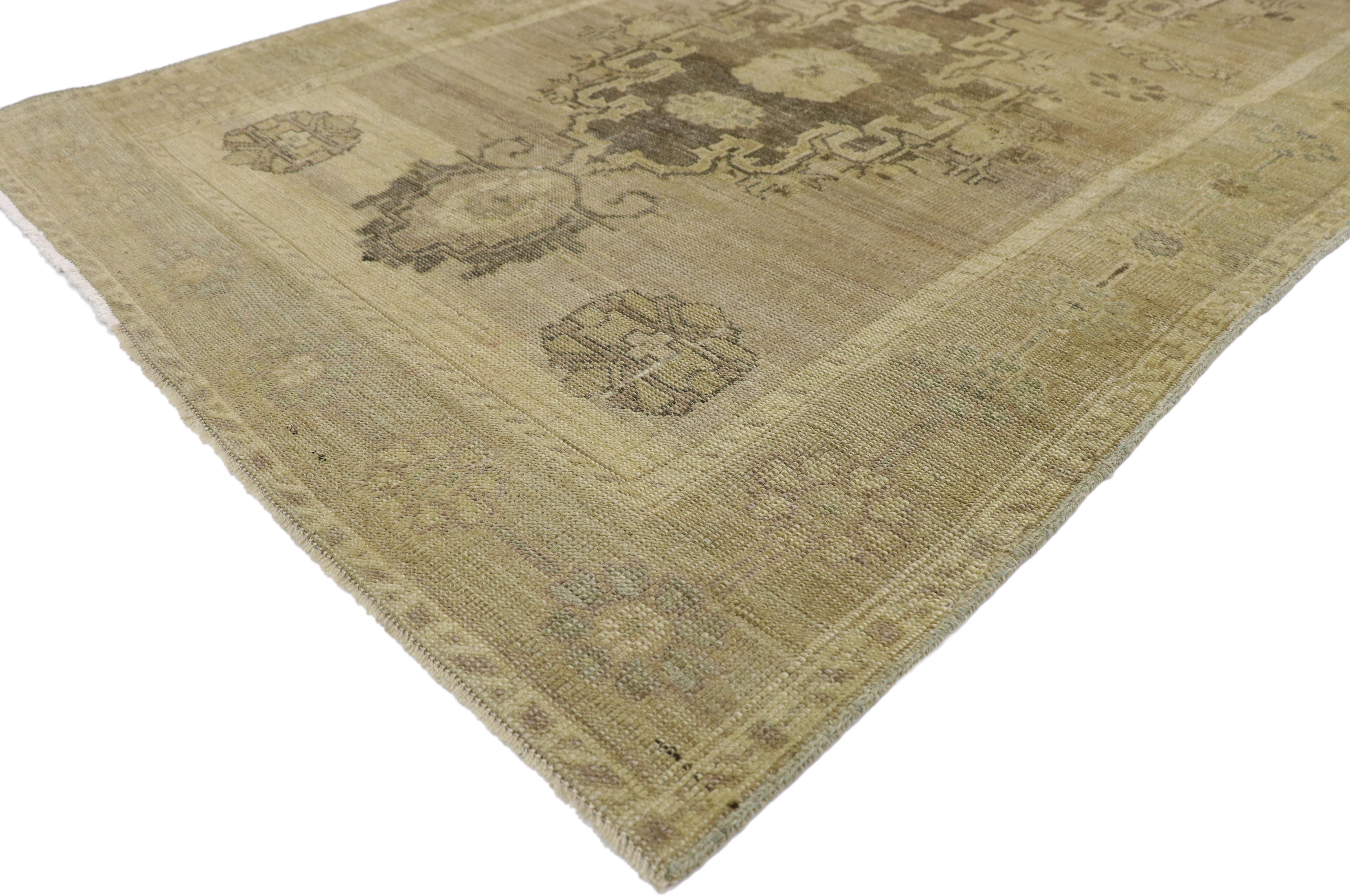 50838, vintage Turkish Oushak hallway runner with American colonial style. This hand knotted vintage Turkish Oushak runner features three cusped medallions, each filled with three roundel rosettes and outlined with a thick vine and serrated