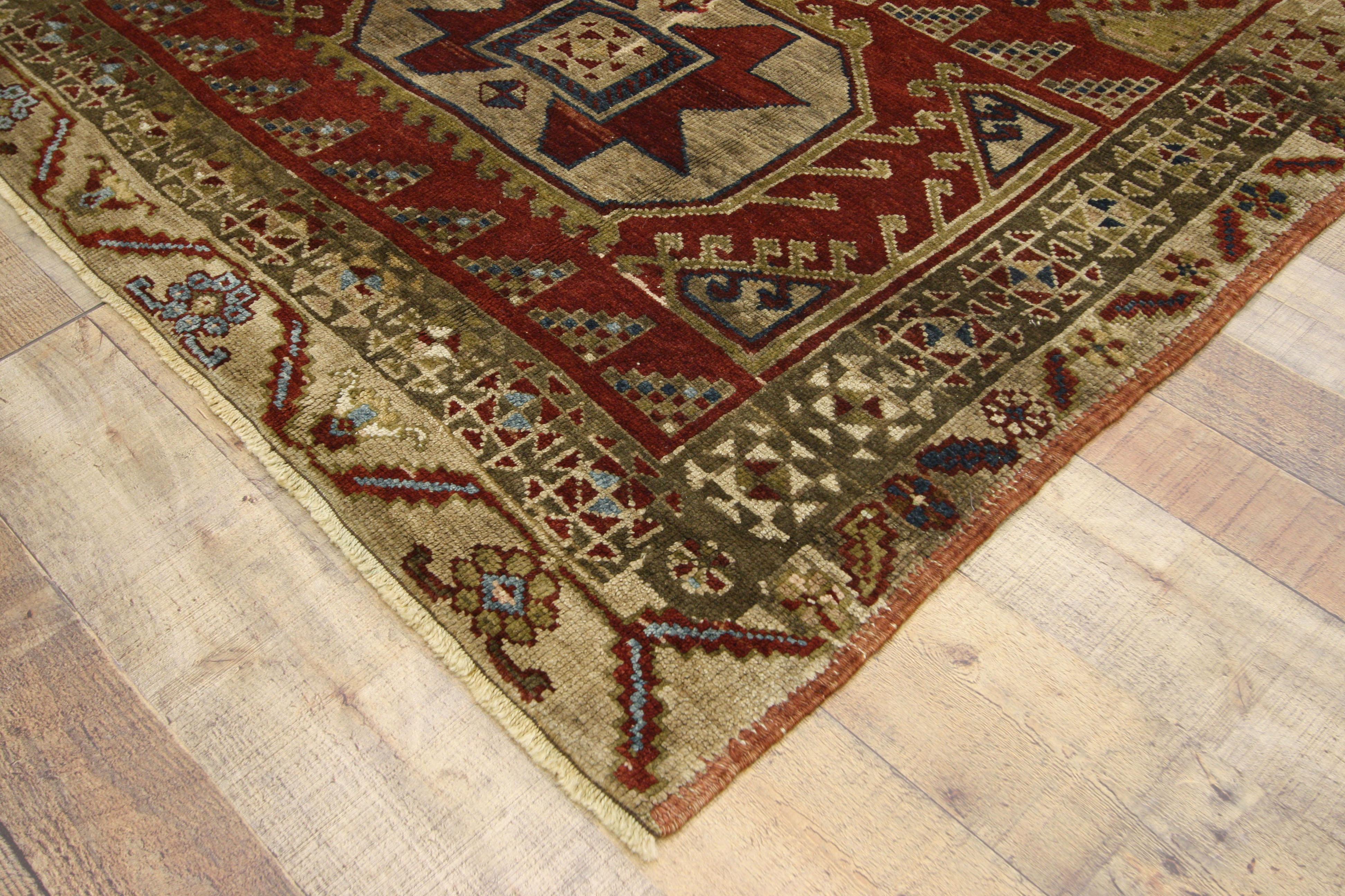 52398, vintage Turkish Oushak hallway runner with Art Deco Mission Style. This hand knotted wool vintage Turkish Oushak runner features a paneled design with five large latch-hooked hexagonal medallions spread across an abrashed ruby red field.