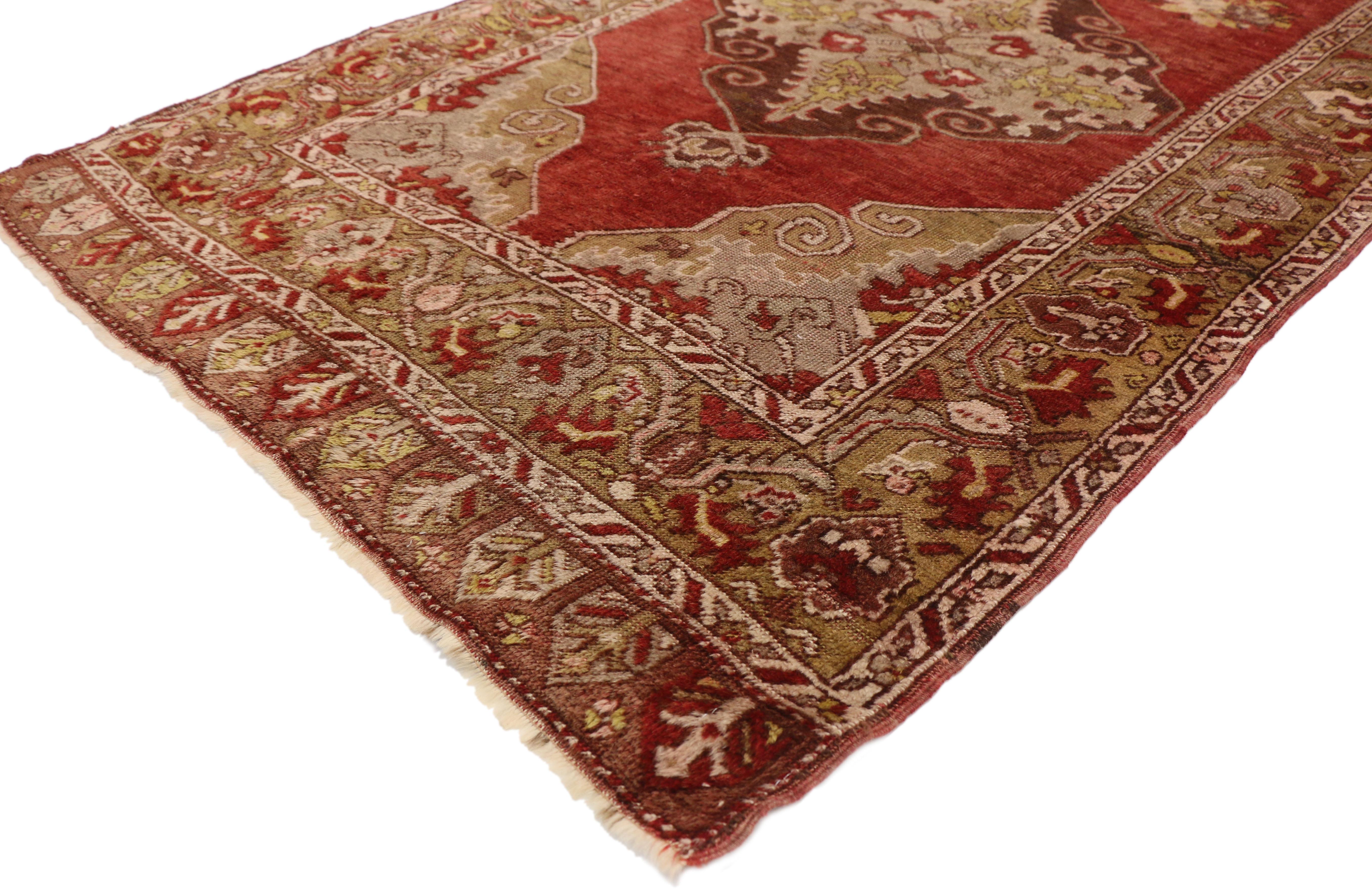77291 vintage Turkish Oushak Hallway Runner. This hand knotted wool vintage Turkish Oushak hallway runner features three stacked lozenge medallions anchored with palmette finials floating in a sea of red abrash. The three lozenge medallions are