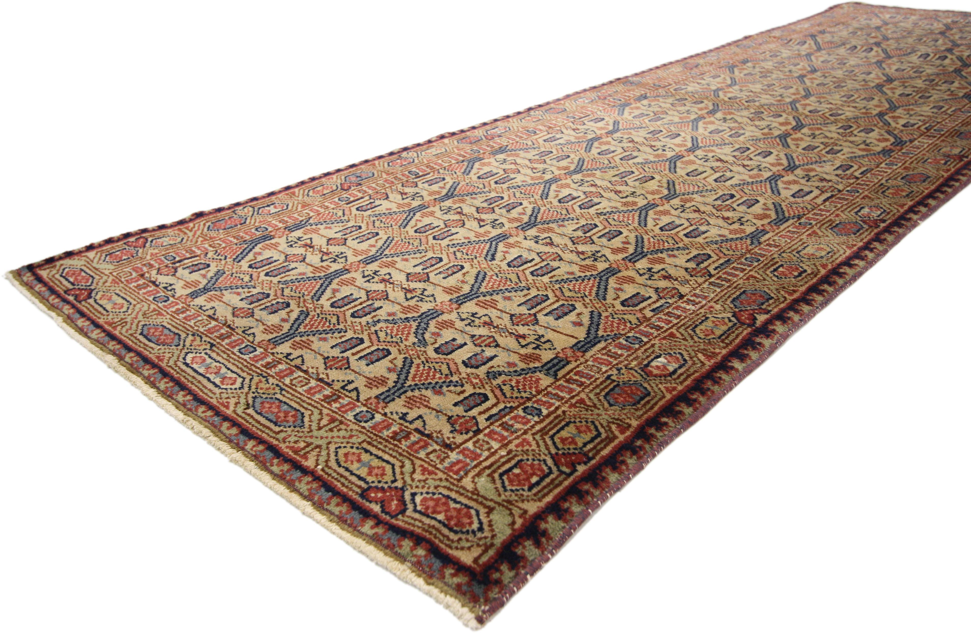 51338 Vintage Turkish Oushak Hallway Runner with Rustic Art Deco Style 02'09 x 08'08. Delicate yet bold, this hand-knotted wool vintage Turkish Oushak runner displays a geometric lattice pattern composed of symbolic Anatolian tribal motifs. Enhanced