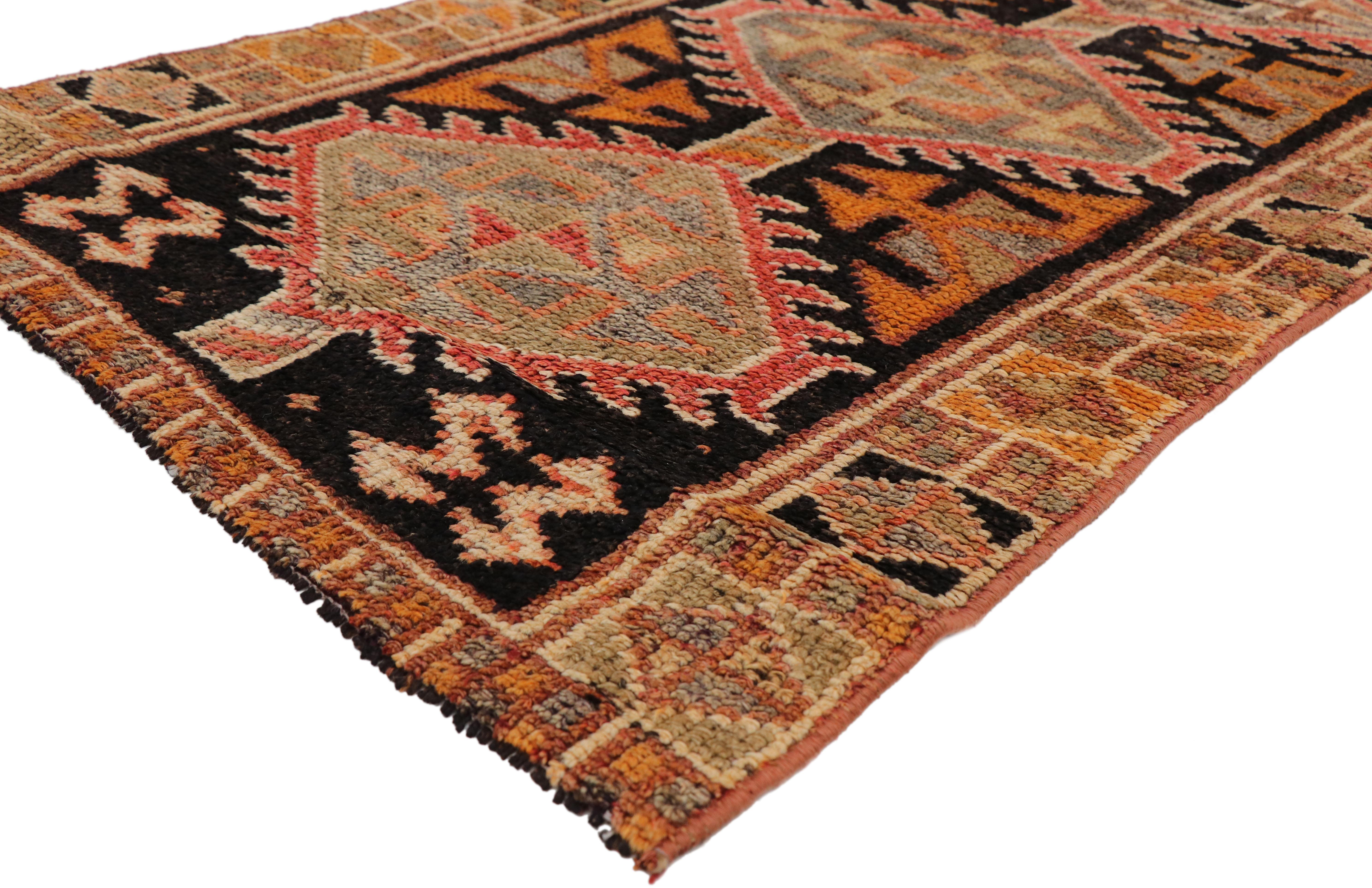 51717, vintage Turkish Oushak hallway runner with Rustic Arts & Crafts style. This hand knotted wool vintage Turkish Oushak runner features a series of hooked hexagonal pole medallions in alternating colors spread across an abrashed onyx field.