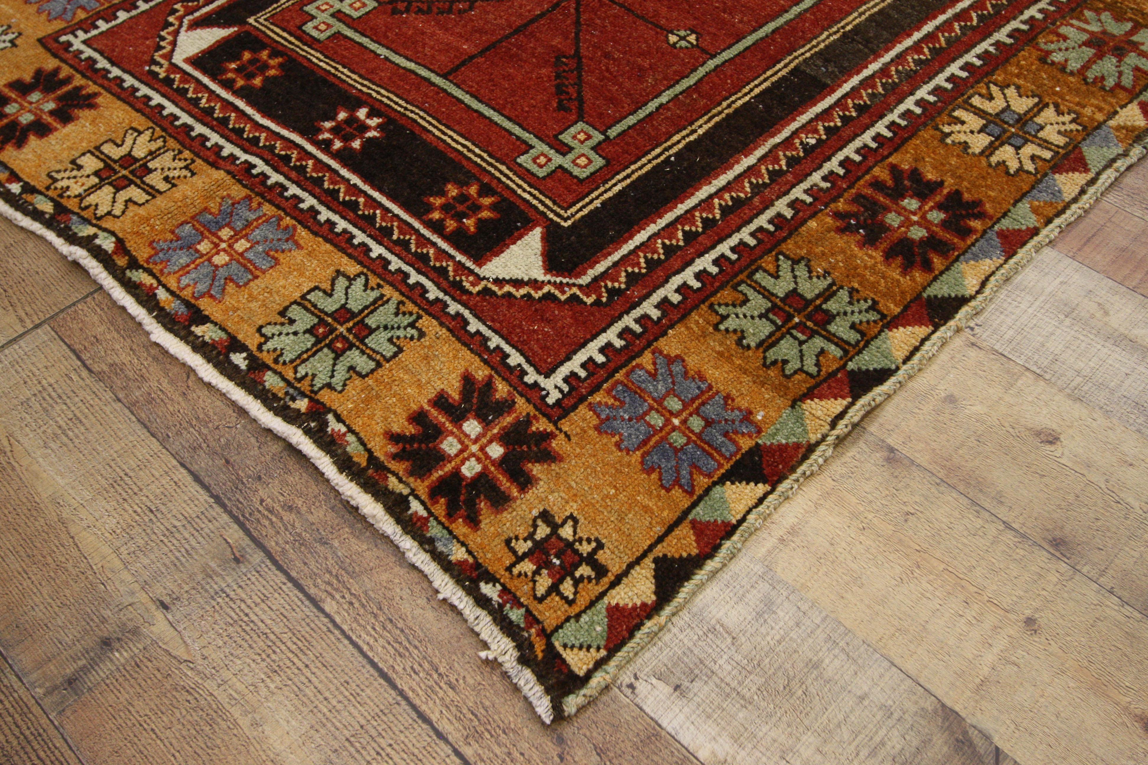 52393, vintage Turkish Oushak hallway runner with tribal Mission style. This hand knotted wool vintage Turkish Oushak runner features four large octagonal medallions spread across an abrashed field. Each medallion contains concentric rectangles with