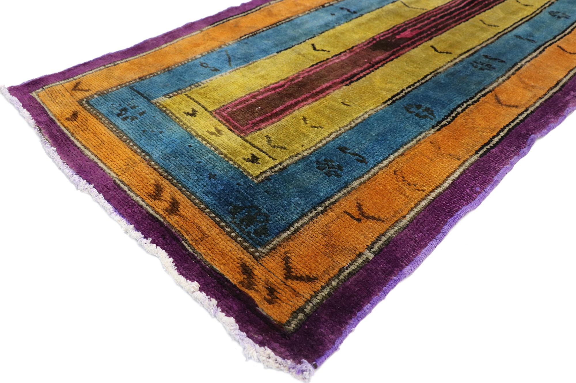 52065, vintage Turkish Oushak extra-long hallway runner with Art Deco style. This hand-knotted wool vintage Turkish Oushak runner with tribal style features a multiple border design rendered in pink, yellow, blue, orange, purple and brown. This