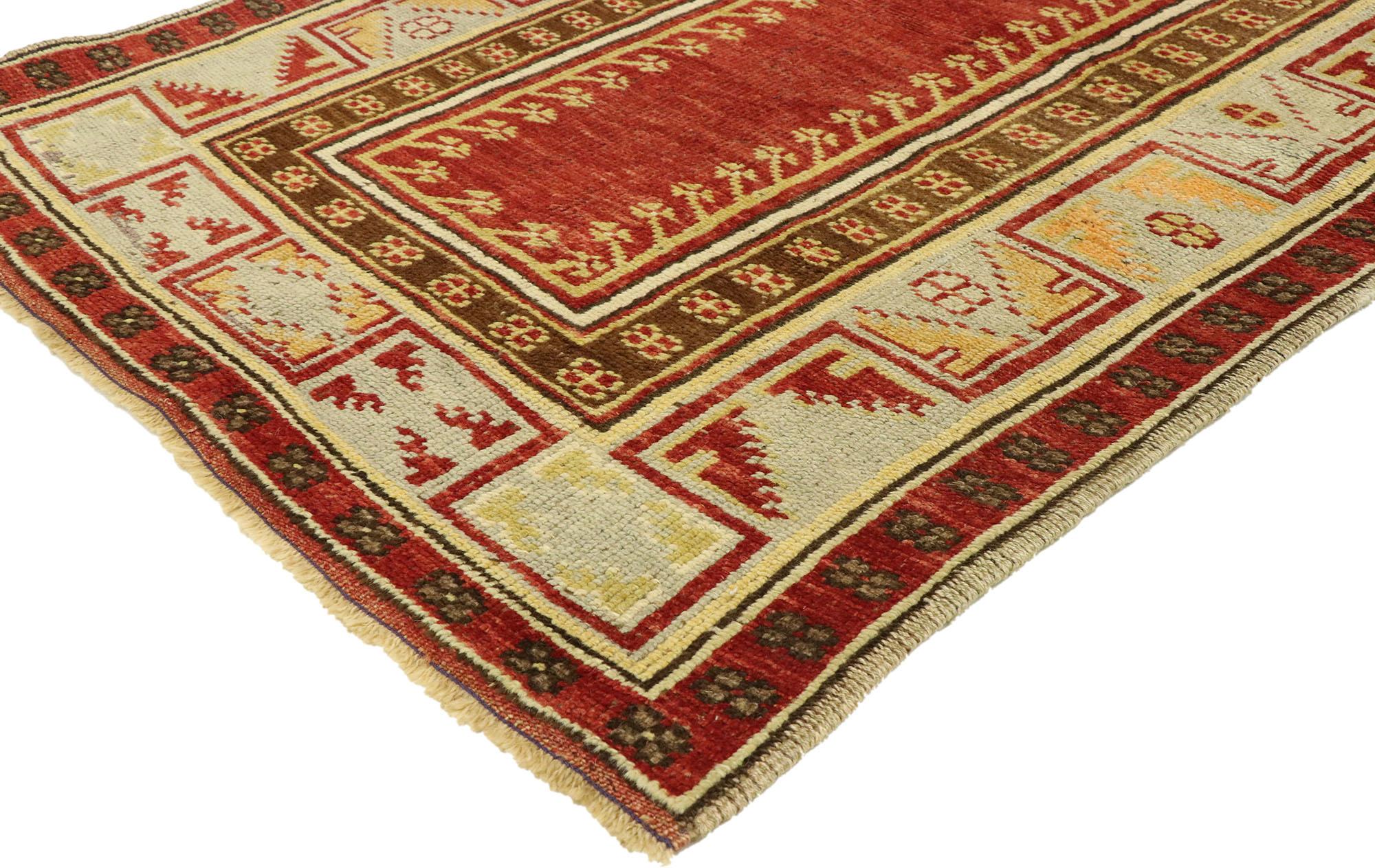 51316, vintage Turkish Oushak Prayer rug. Immersed in Anatolian history and refined colors, this hand knotted wool vintage Turkish Oushak prayer rug combines simplicity with sophistication. It features a stepped mihrab with an open abrashed red