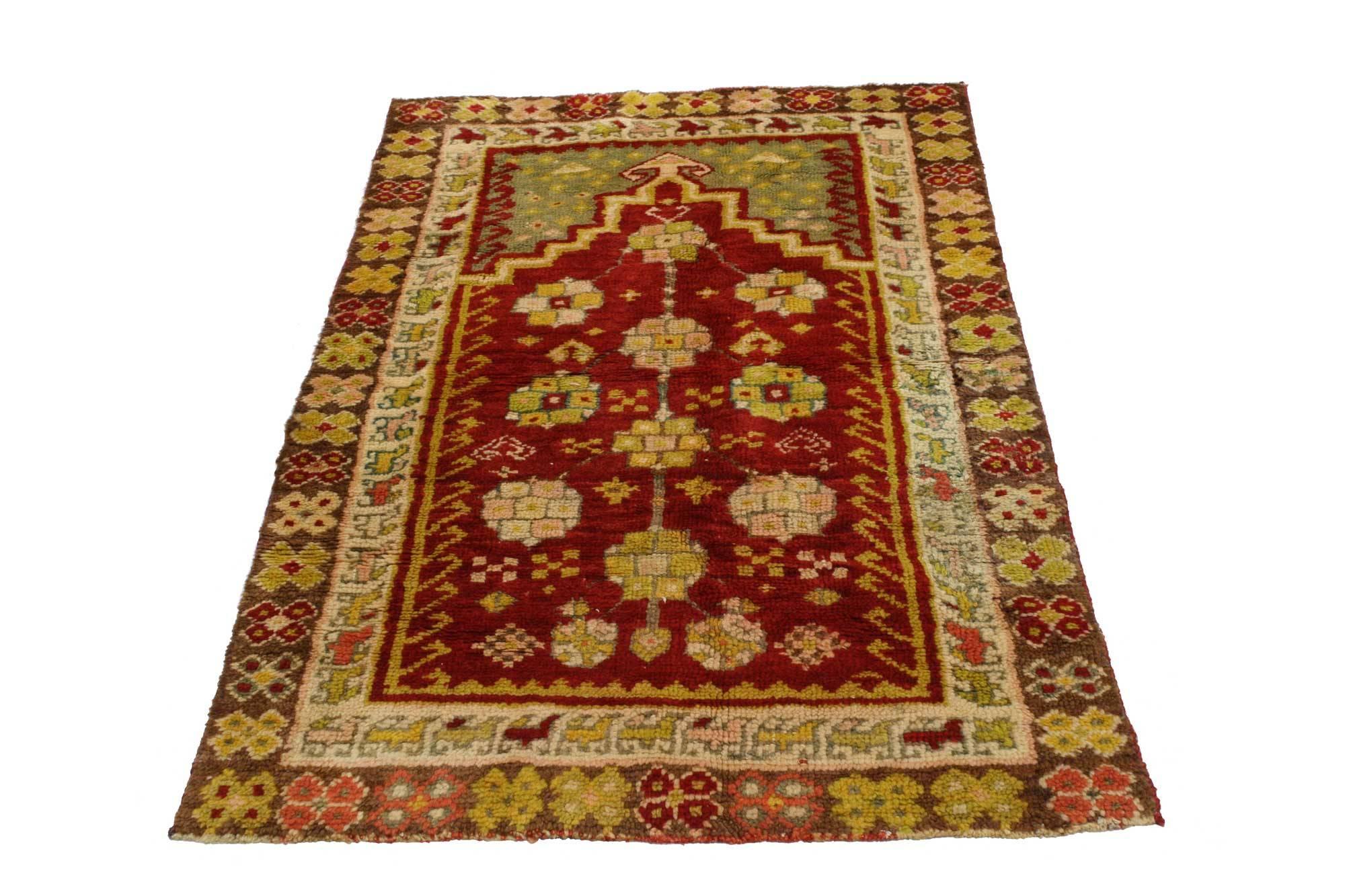 51686, vintage Turkish Oushak prayer rug. This captivating vintage Turkish Oushak prayer rug features the motif of a stepped edge mihrab, or prayer niche, topped with an arrow head finial. Multi-color blossoms fill the carpet field meanwhile