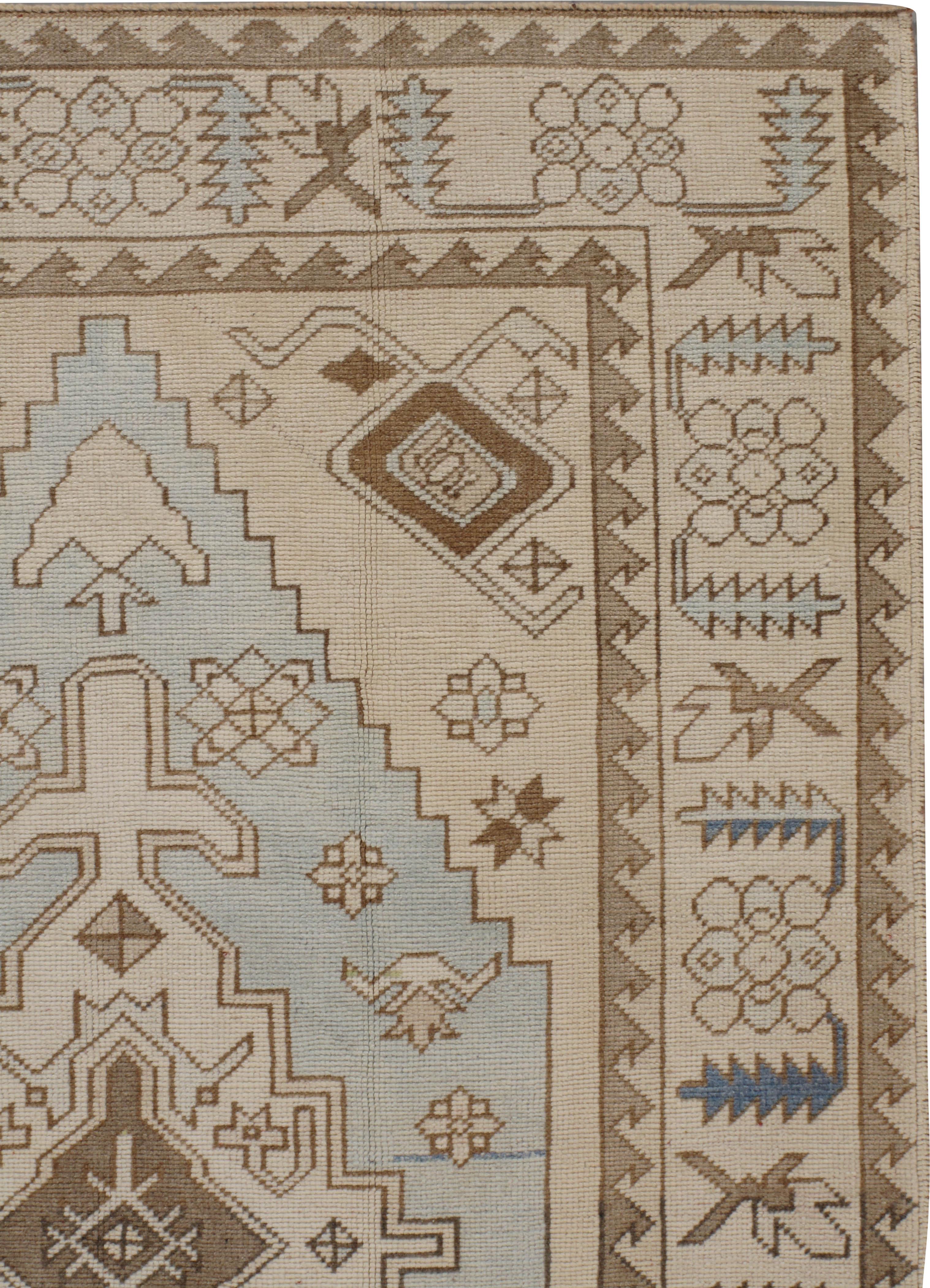 Hand-Woven Vintage Subdued Ivory Blue Turkish Wool Hand Knotted Oushak Rug For Sale
