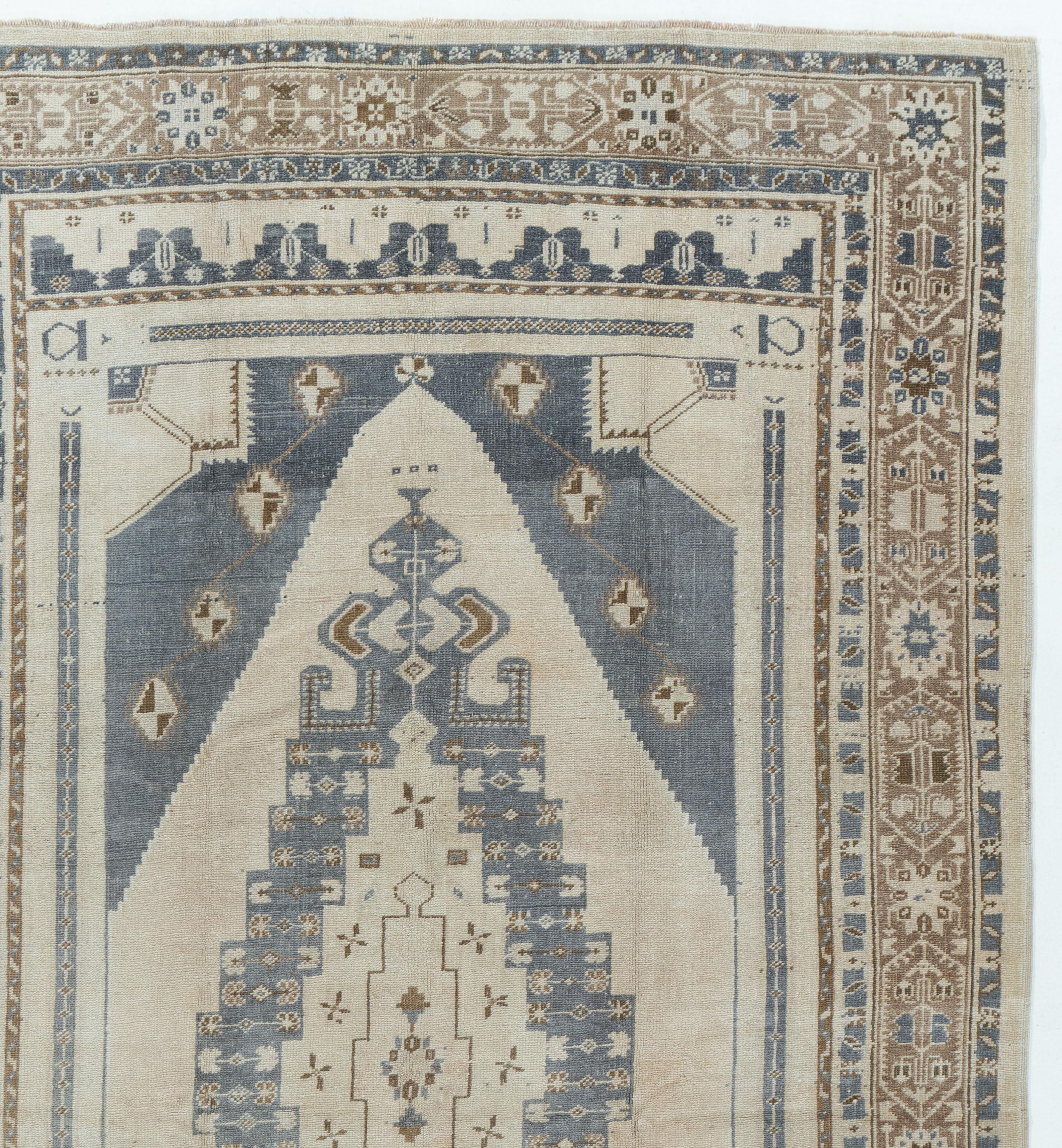 Vintage Turkish Oushak Rug 4'9 x 8'4.  Hand-woven in Turkey where rug weaving is the culture rather than a business. Rugs from Turkey are known for the high quality of their wool their beautiful patterns and warm colors. These designer favorites