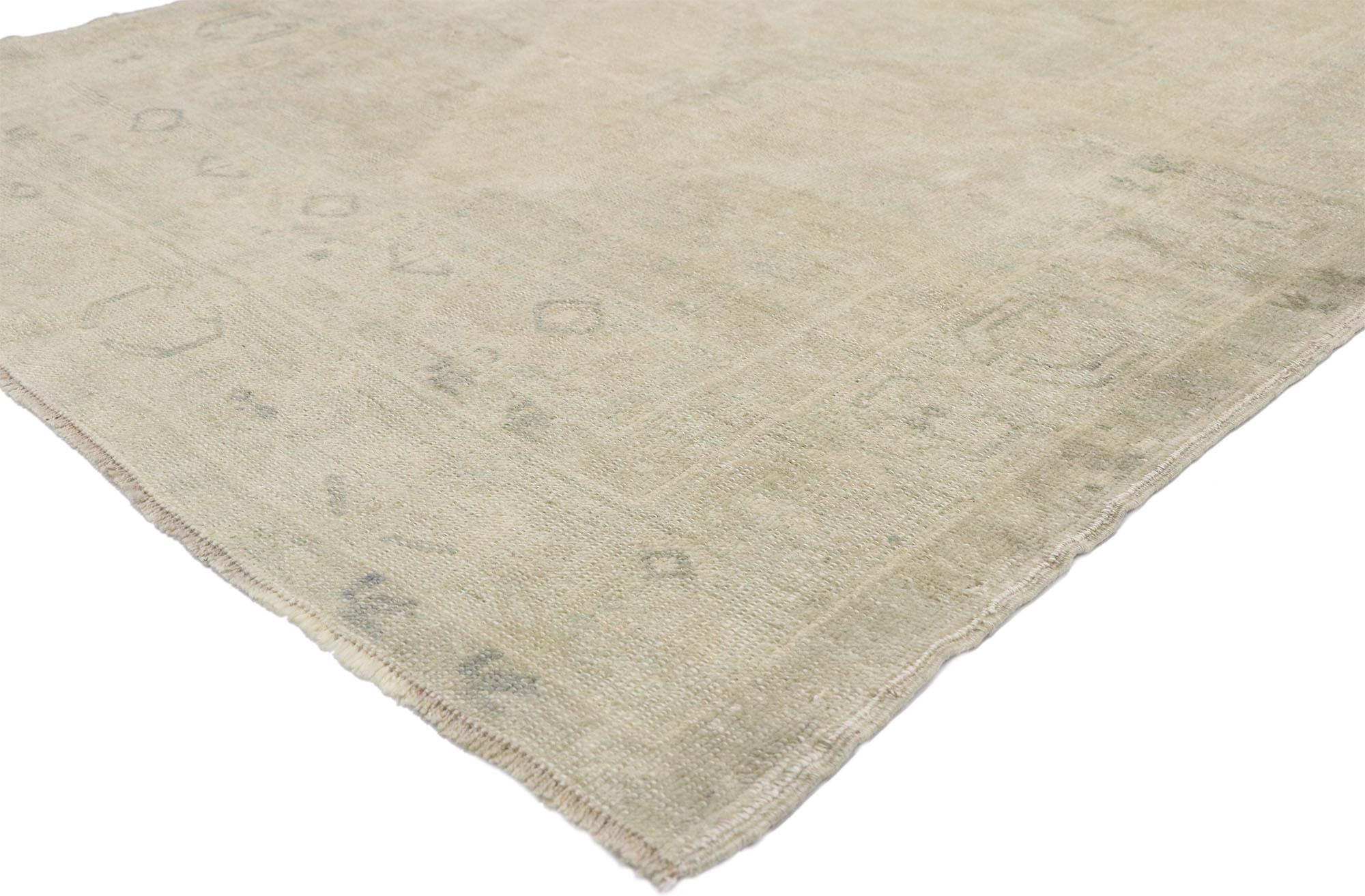 52676 Muted Vintage Turkish Oushak Rug, 03'10 x 07'10.
Calm cohesion meets easygoing elegance in this hand knotted wool vintage Turkish Oushak rug. The faded geometric pattern and muted colorway woven into this piece work together creating a