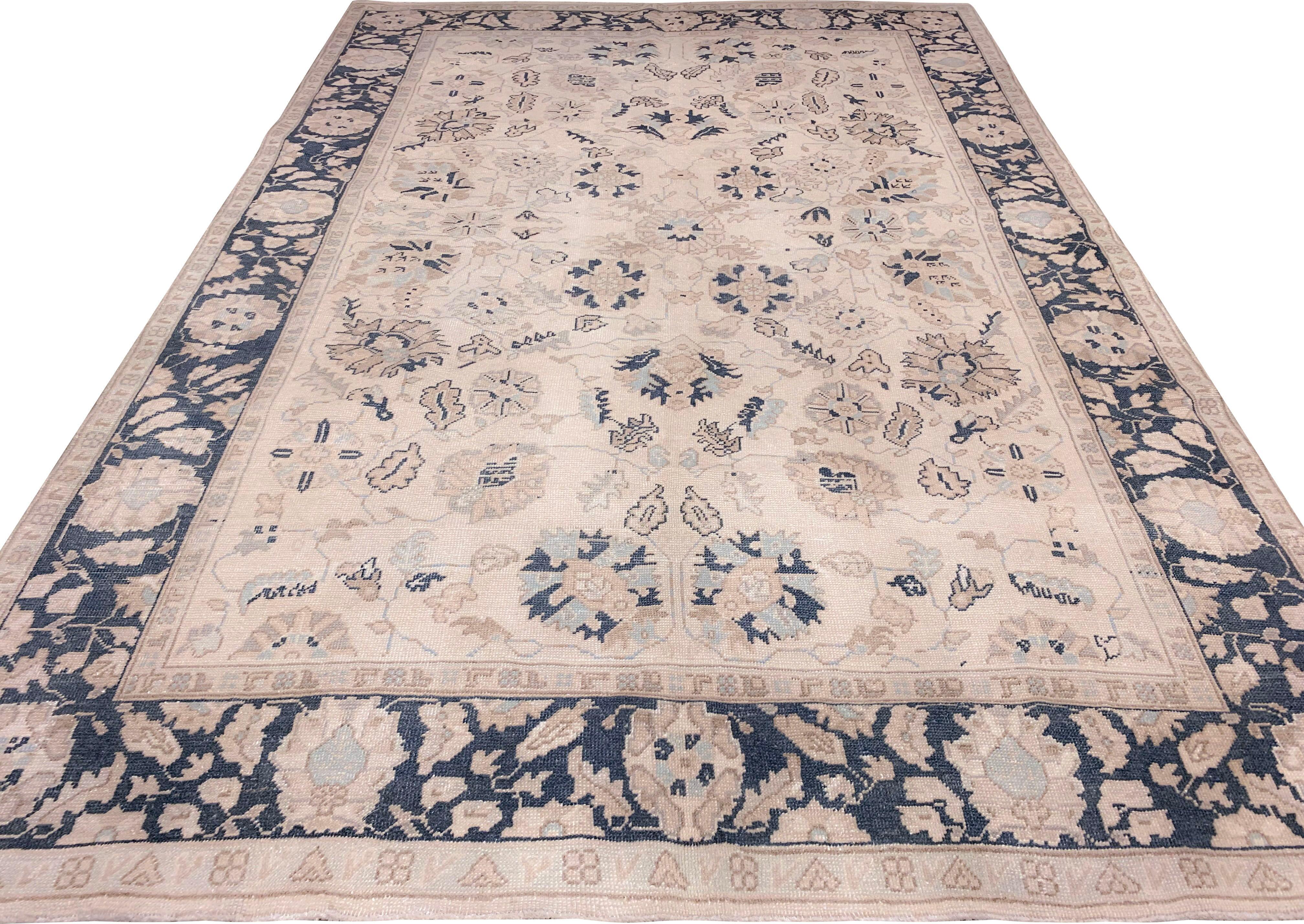 Vintage Turkish Oushak rug, circa 1940, 6'11 x 9'11. Handwoven in Turkey where rug weaving is the culture rather than a business. Rugs from Turkey are known for the high quality of their wool their beautiful patterns and warm colors. These designer