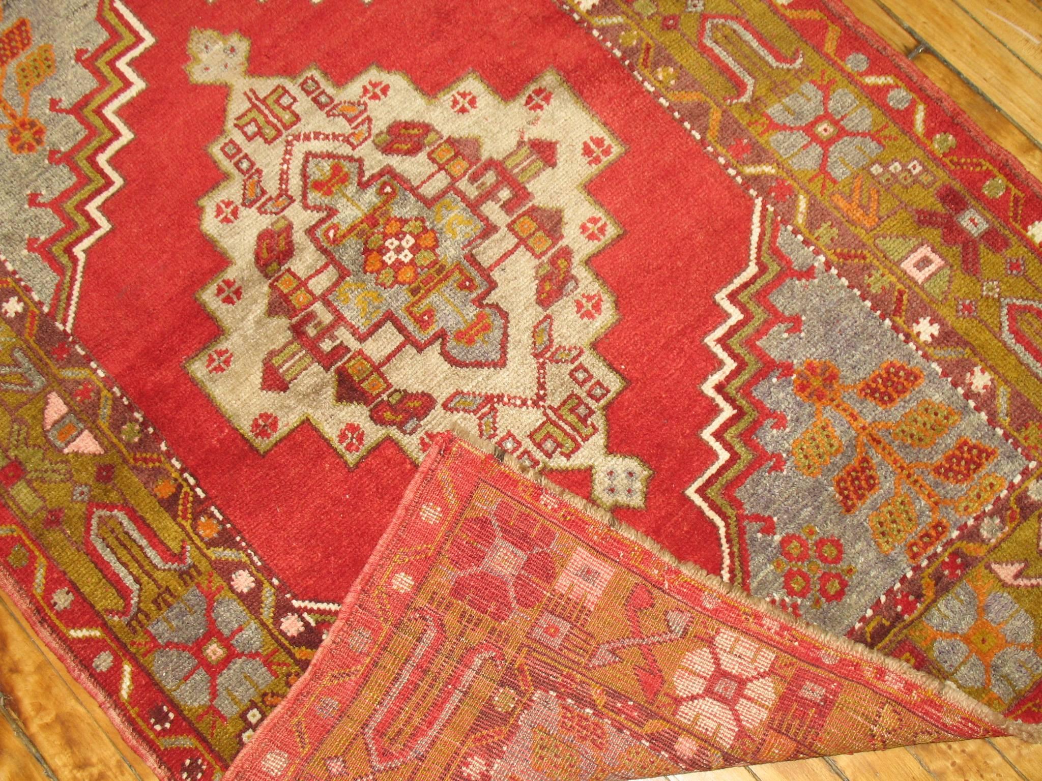 A mid-20th century Turkish Oushak in bright vivid colors.