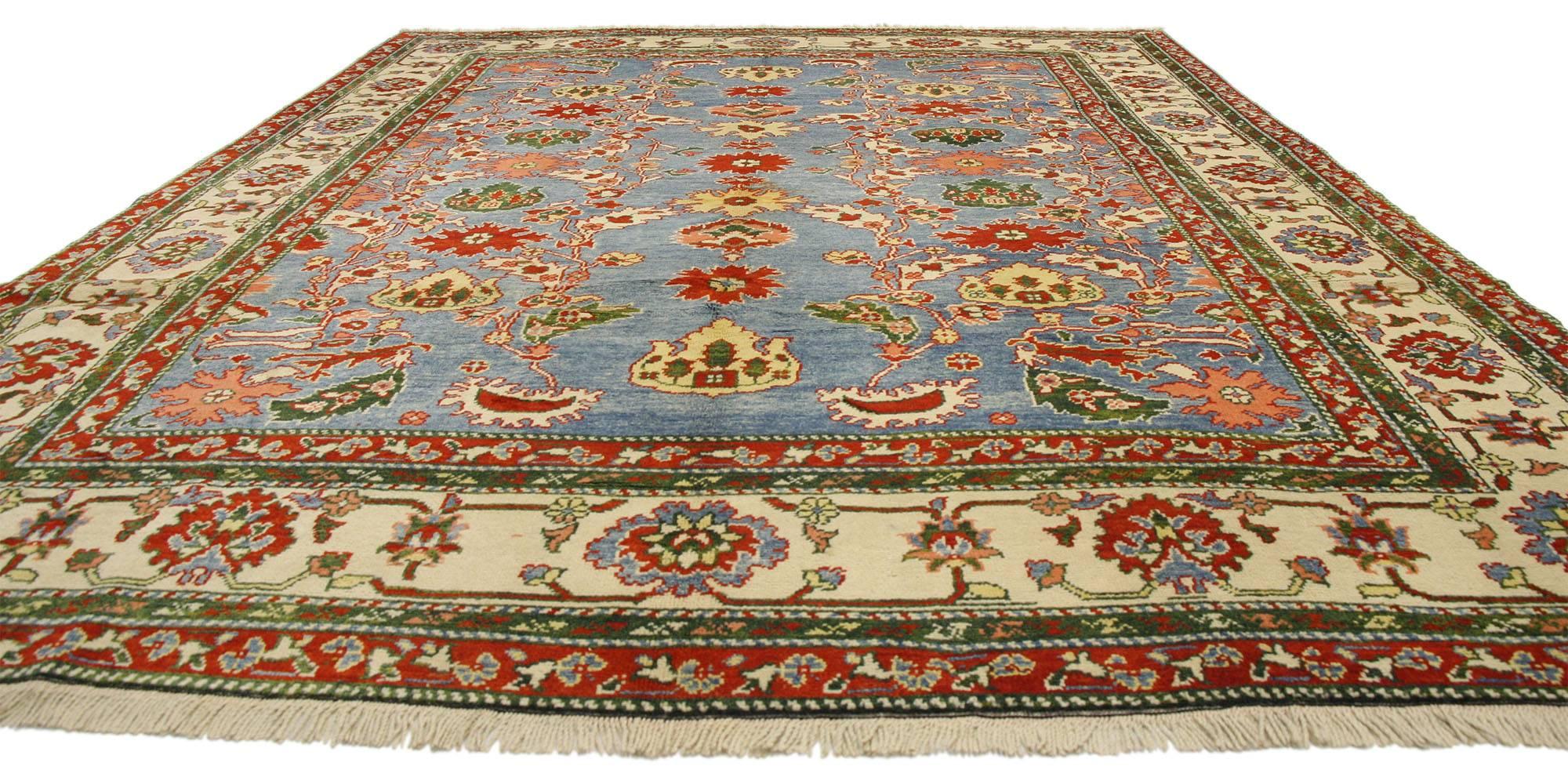 77134, vintage Turkish Oushak rug. This hand-knotted wool vintage Turkish Oushak rug features an allover geometric pattern surrounded by a classic border creating a well-balanced and timeless design. This vintage Oushak rug brings a subtle elegance