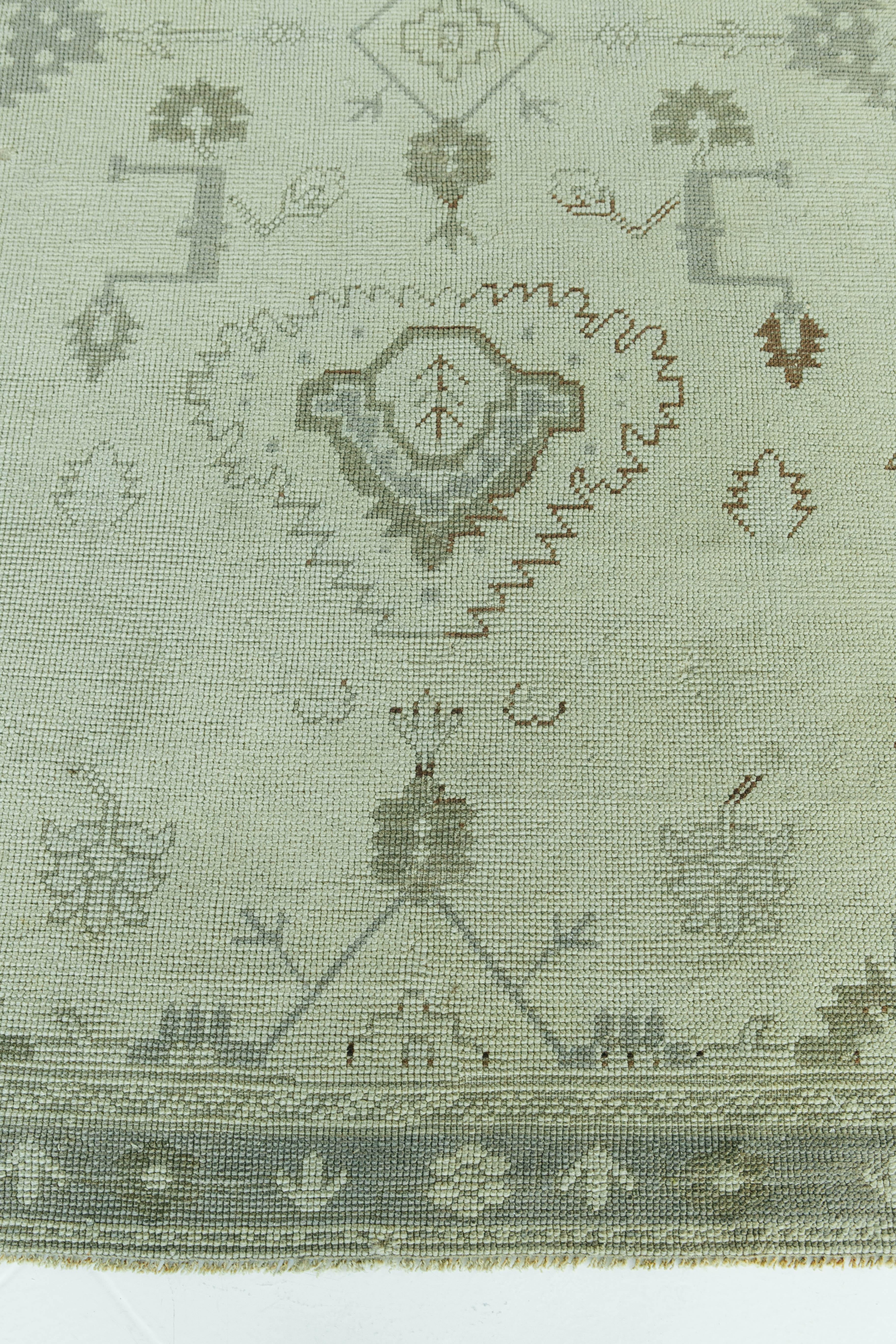 A vintage Turkish Oushak rug in ivory and taupe colors. This rug is unique for it's tribal motifs that a simple in design yet interesting for the viewer's eye. This rug will bring character to any space.


Rug number: 56559
Size: 4'10