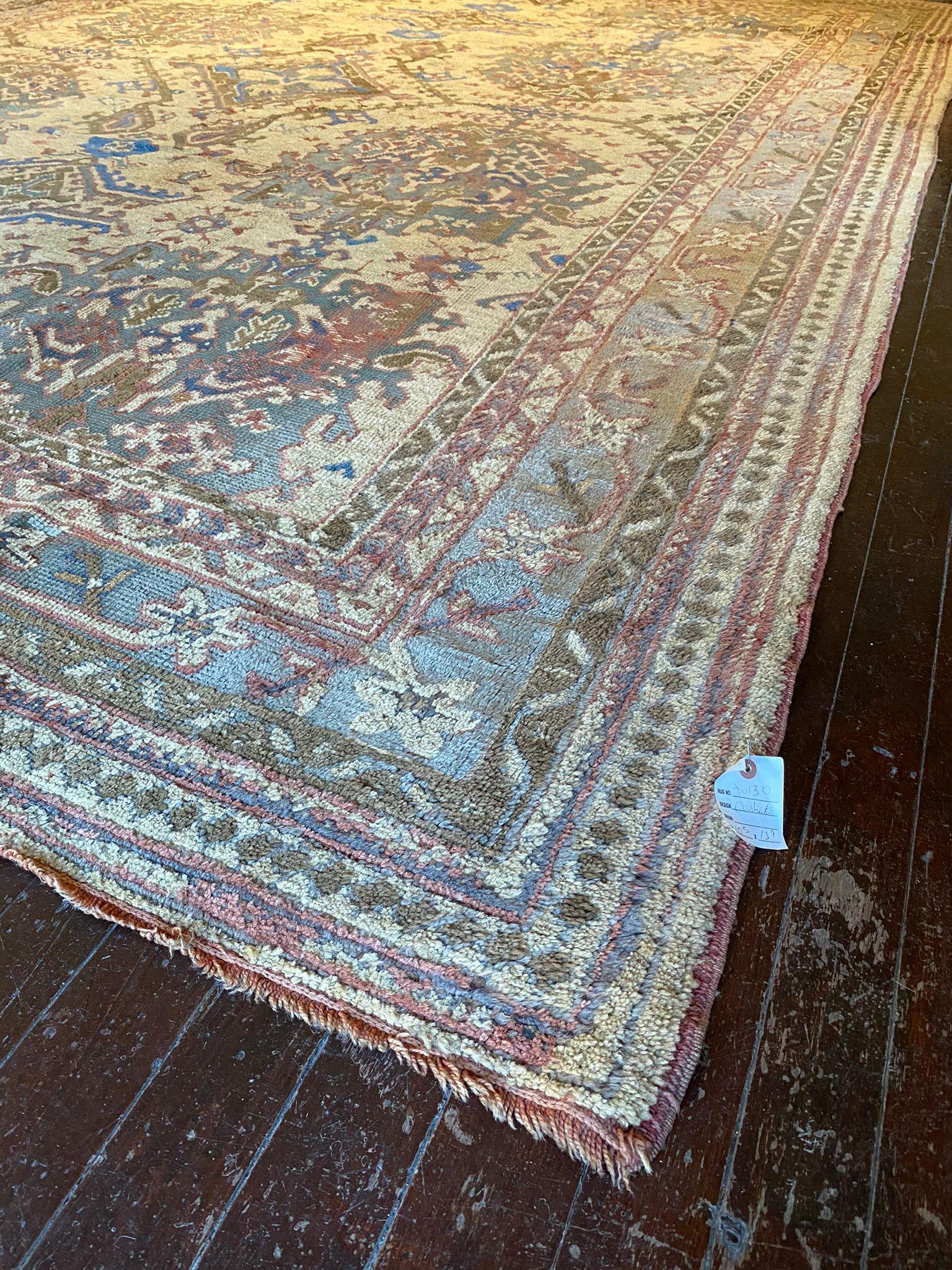 This rug exudes a sense of timeless beauty and sophistication. Measuring 10 feet 5 inches in width by 13 feet 9 inches in length, this Vintage Turkish Oushak Rug is generously sized and will make a striking statement in any room. Its design is