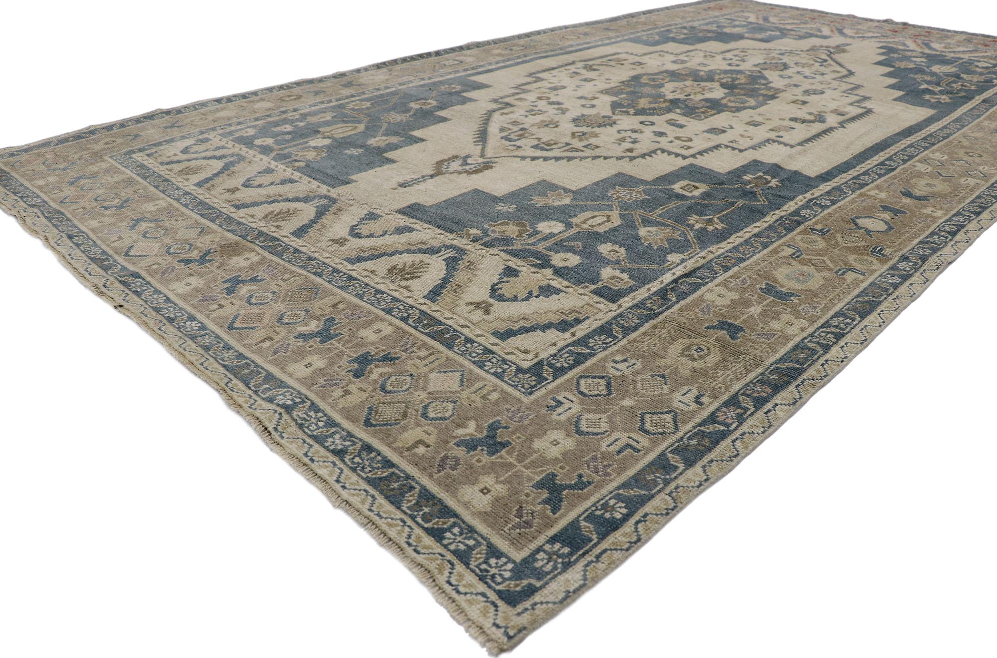 53621 Vintage Turkish Oushak Rug, 06'08 x 11'02. ​Effortless beauty and simplicity meet soft, bespoke vibes with Mid-Century Modern style in this hand-knotted wool vintage Turkish Oushak rug. The antique washed cut-out field features a stepped