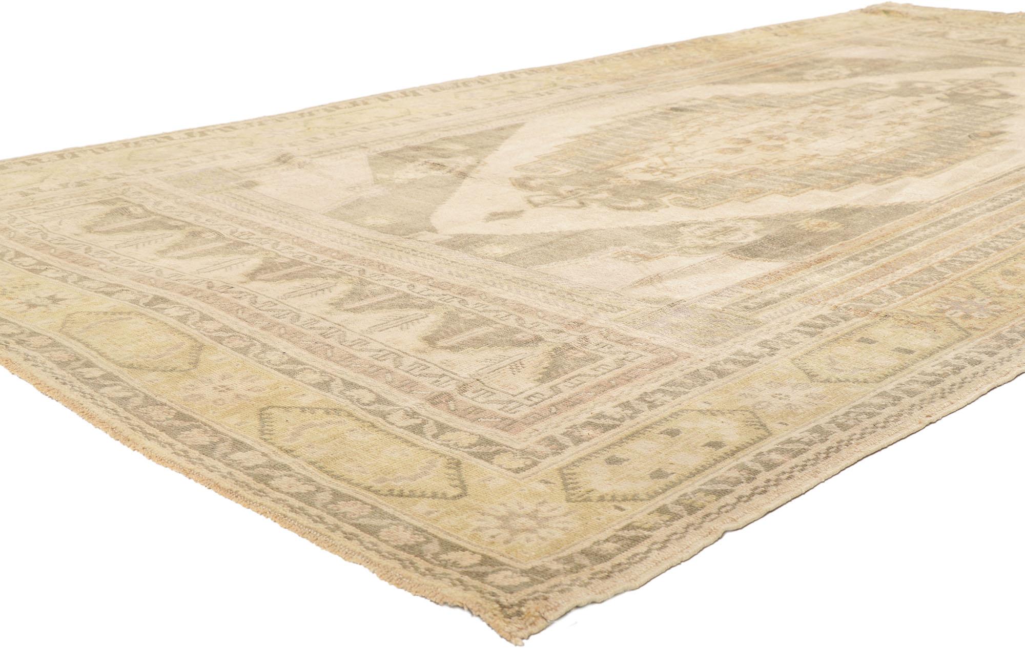 ​53674 Vintage Turkish Oushak Rug, 05'04 x 10'08.
Slip into a world of classic charm and modern flair with this hand knotted wool vintage Turkish Oushak rug. The intricate botanical pattern and subtle earthy hues work together creating an air of