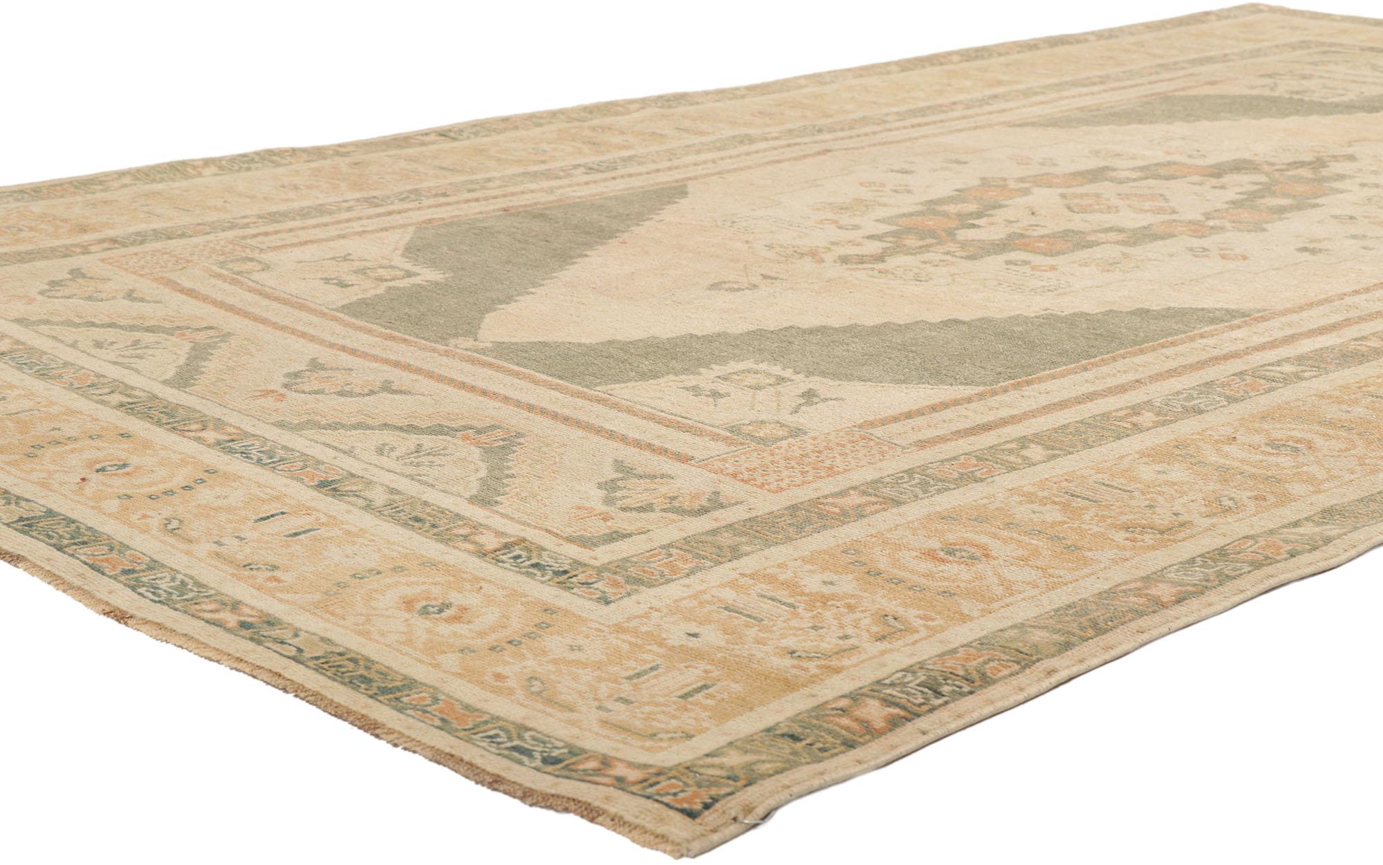 53678 Vintage Turkish Oushak Rug, 05'09 x 09'04.
Transport yourself into a world of sophisticated elegance and tranquil sensibility with this hand knotted wool vintage Turkish Oushak rug. Its intricate botanical design and nature-inspired color