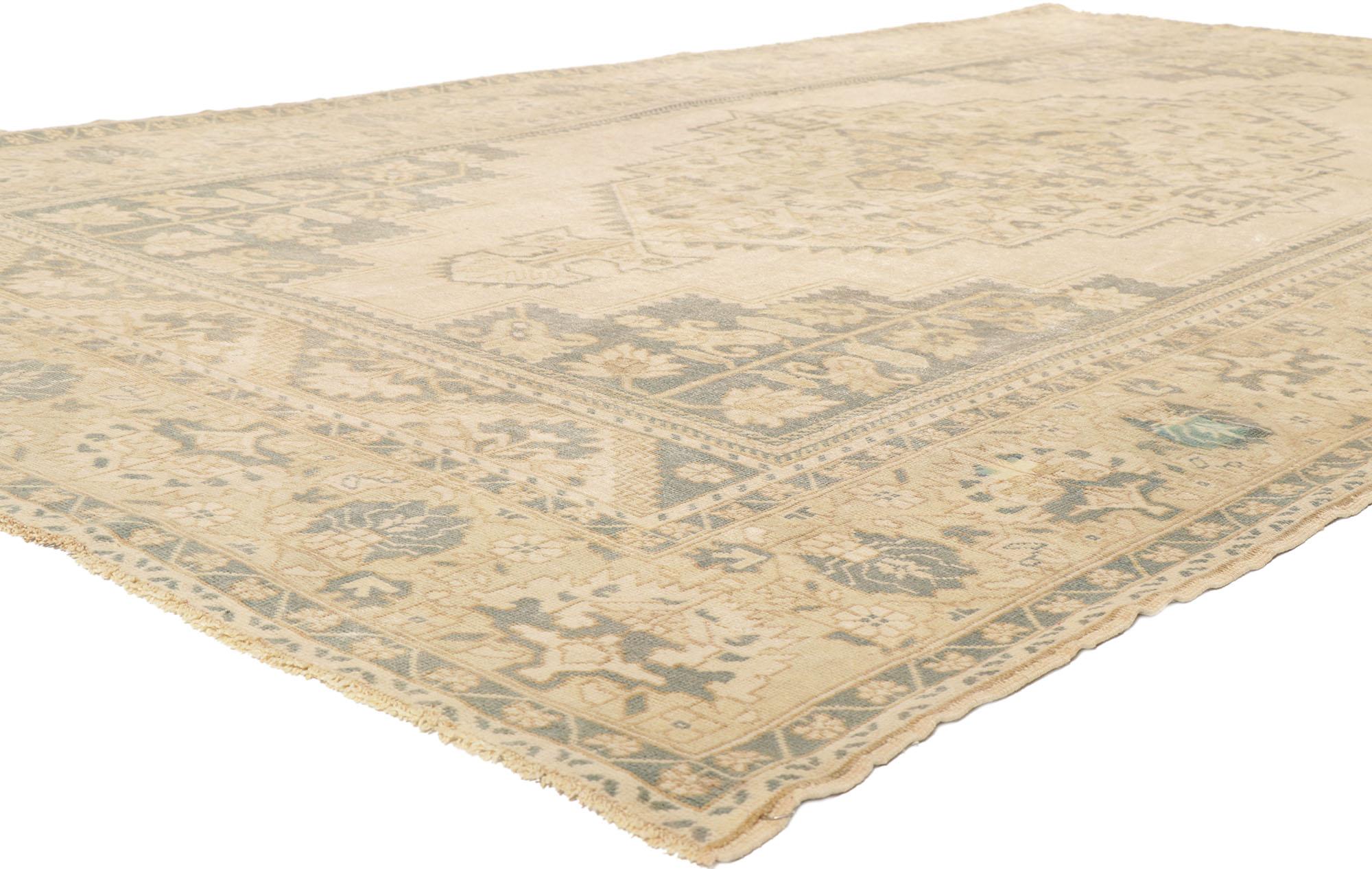 53691 Vintage Turkish Oushak Rug 7'05 x 12'10. Showcasing effortless beauty and soft, bespoke vibes, this hand knotted wool vintage Turkish Oushak rug beautifully embodies romantic cottage style. The antique washed field features a central medallion