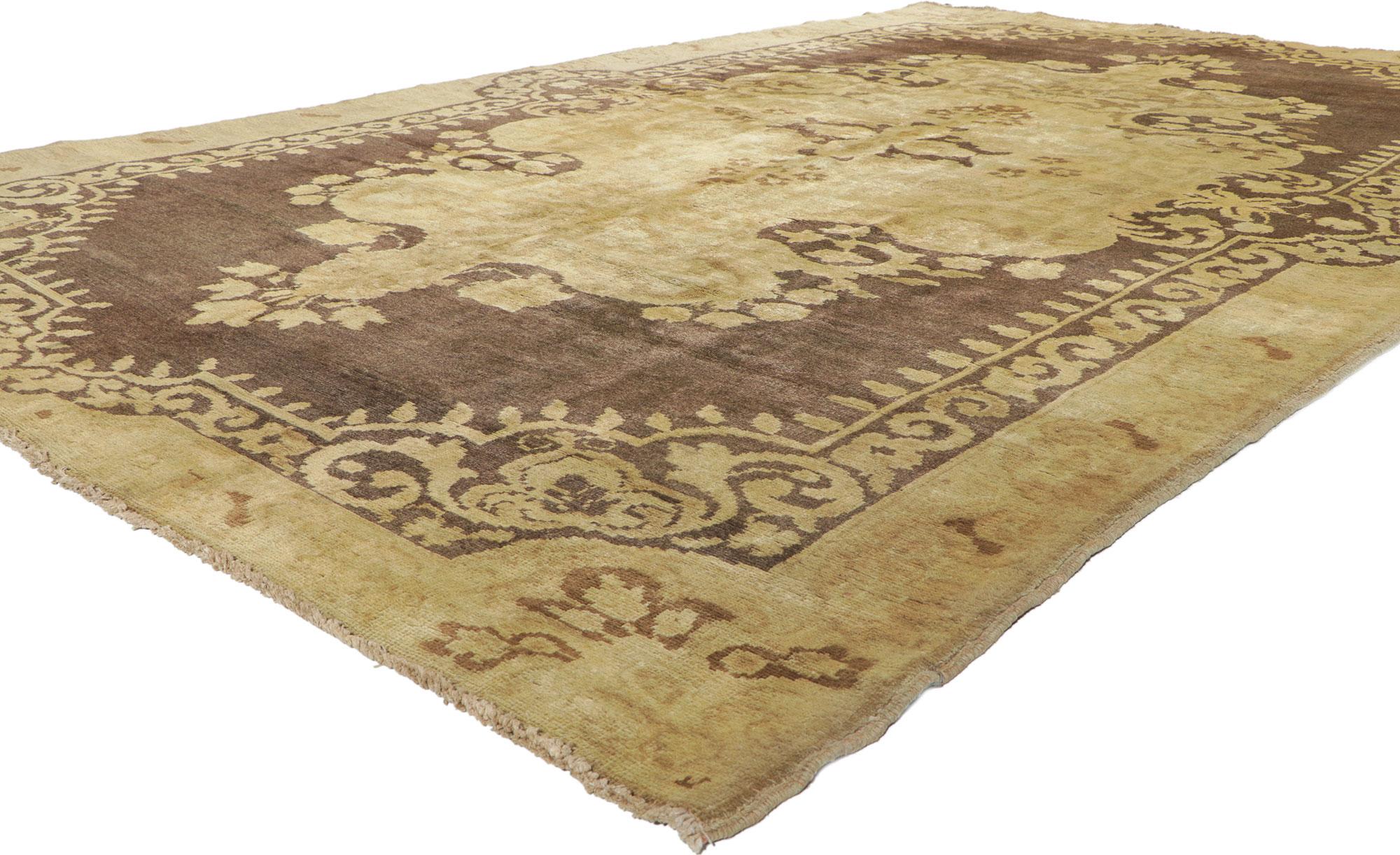 50042 Vintage Turkish Oushak Rug with Warm, Neutral Colors 06’11 x 11’00 From Esmaili Rugs Collection. A grand golden hued filigree medallion with an undulating border replete with florals sits regally on a rich coffee colored field in this