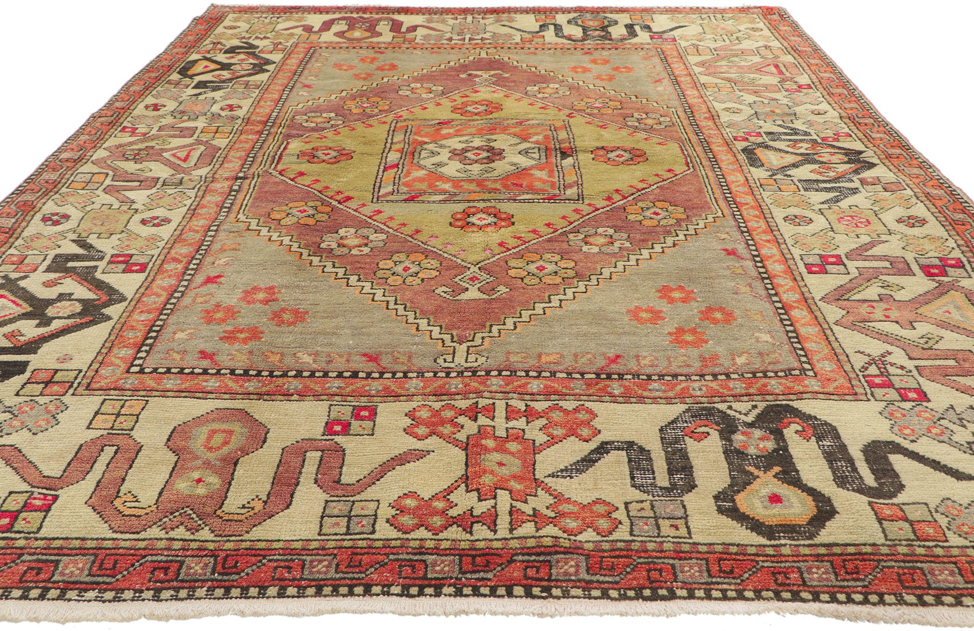 51651 vintage Turkish Oushak rug, 05’07 x 07’10.
Showcasing a bold expressive design, incredible detail and texture, this hand knitted wool vintage Turkish Oushak rug is a captivating vision of woven beauty. The eye-catching medallion design and