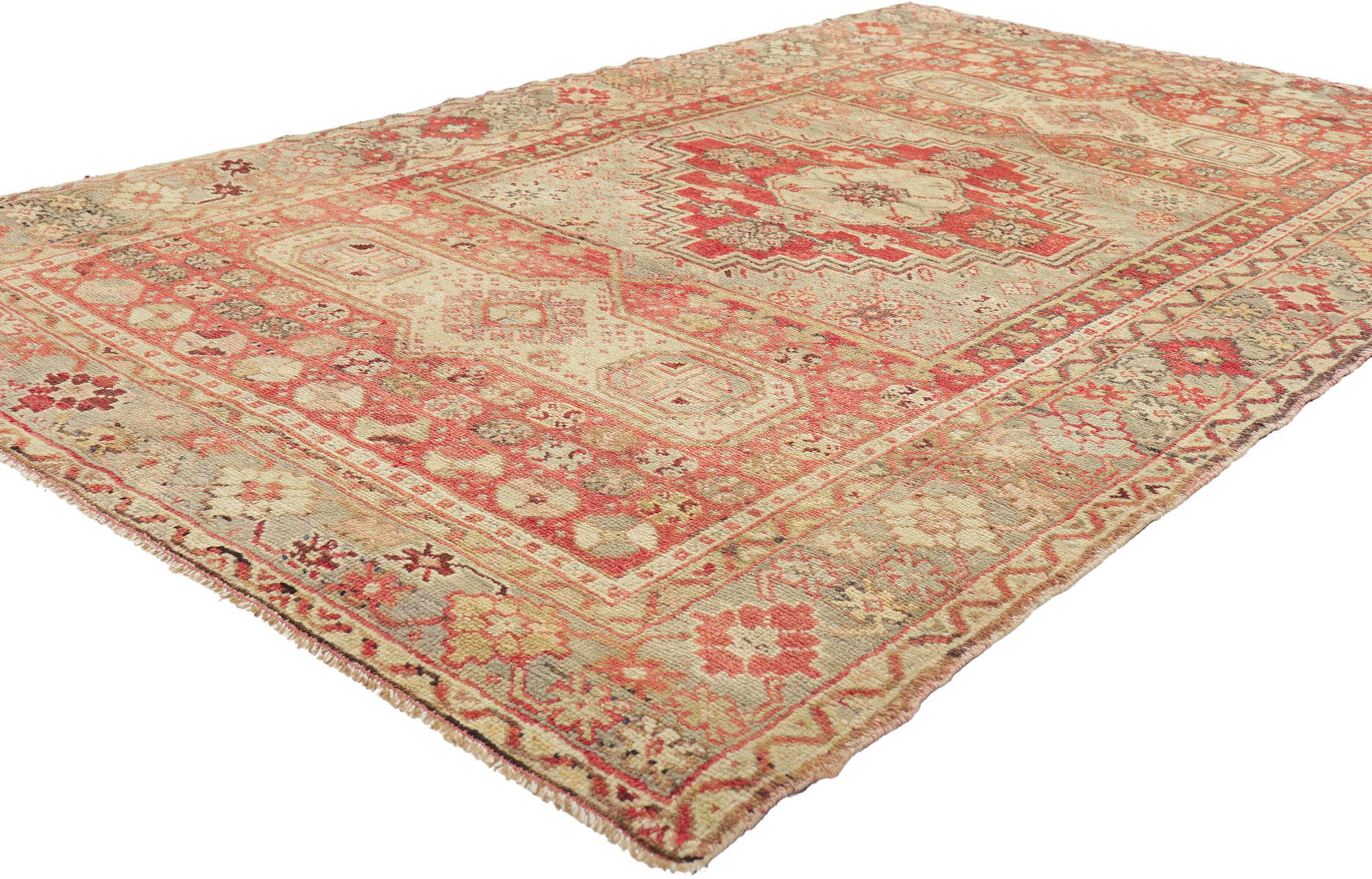 50654 Vintage Turkish Oushak Rug, 04'03 x 07'01.
This hand knotted wool vintage Turkish Oushak rug features a stepped lozenge medallion flanked by two cartouches surrounded by a variety of ancient Anatolian symbols. It is enclosed with a geometric