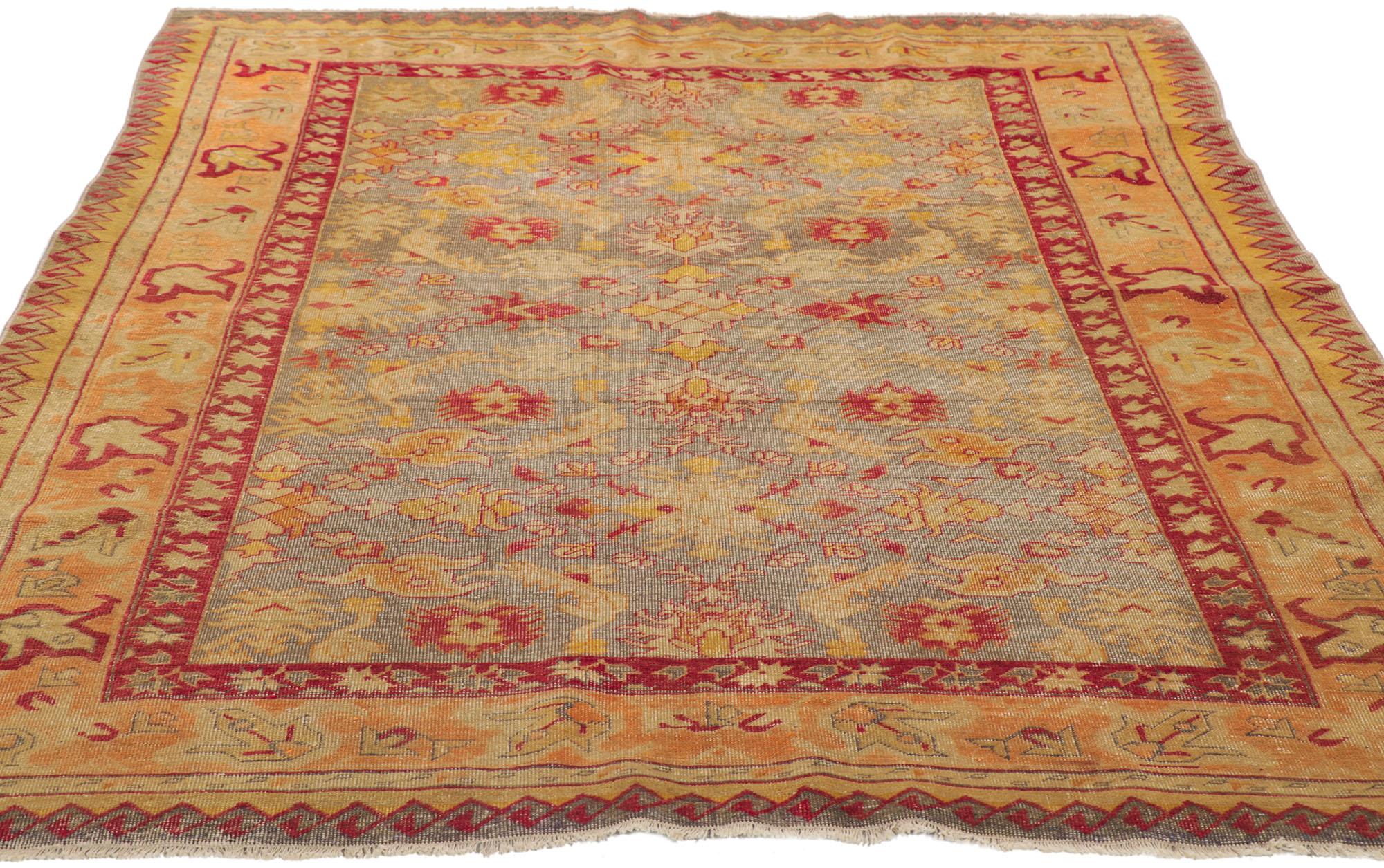 Hand-Knotted Vintage Turkish Oushak Rug, Rustic Sensibility Meets Weathered Finesse For Sale