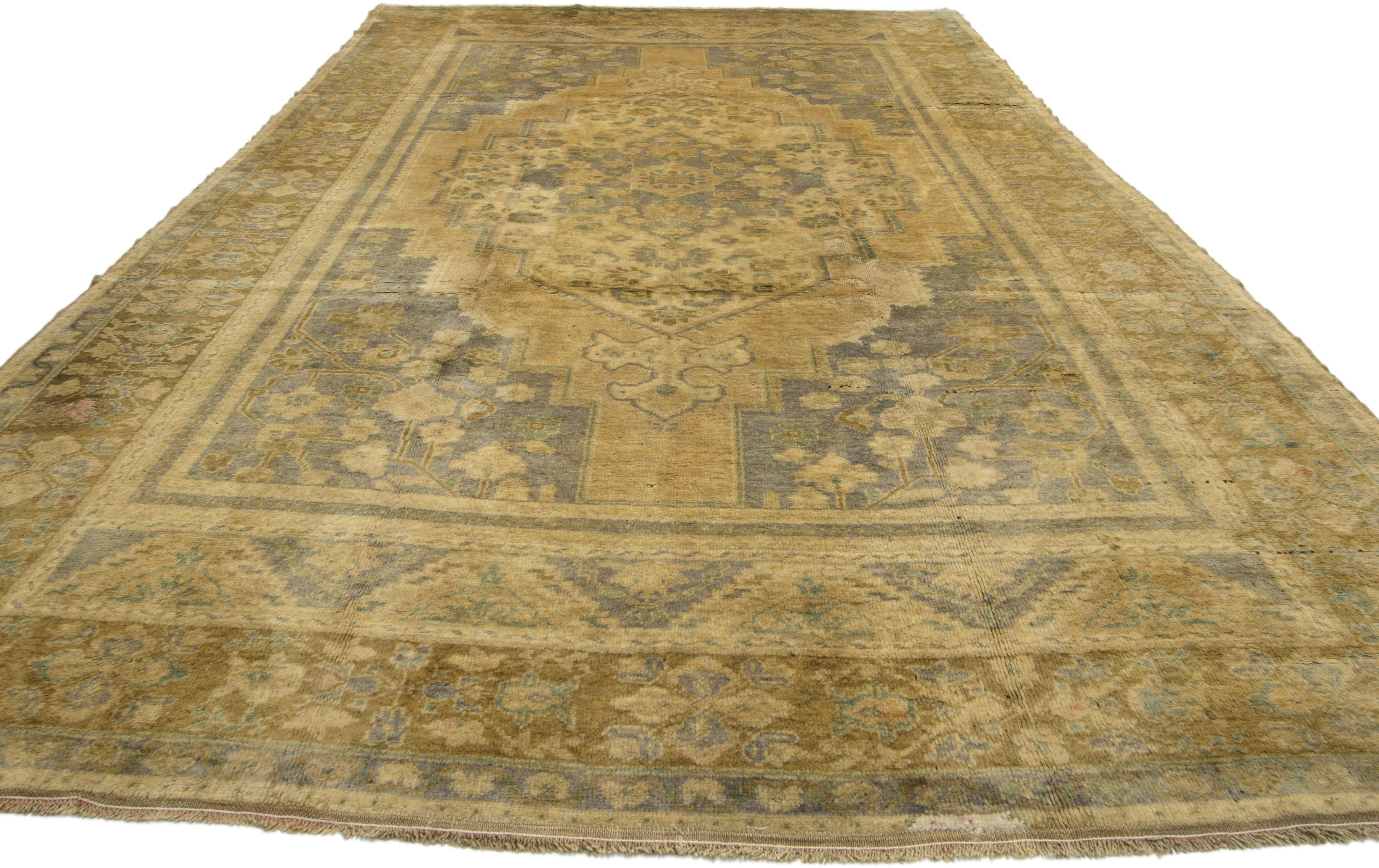 74101, vintage Turkish Oushak rug Gustavian Swedish style. This hand knotted wool vintage Turkish Oushak rug features a double stepped centre medallion anchored with trefoil leaf pendants floating on an abrashed golden field. The spandrels are