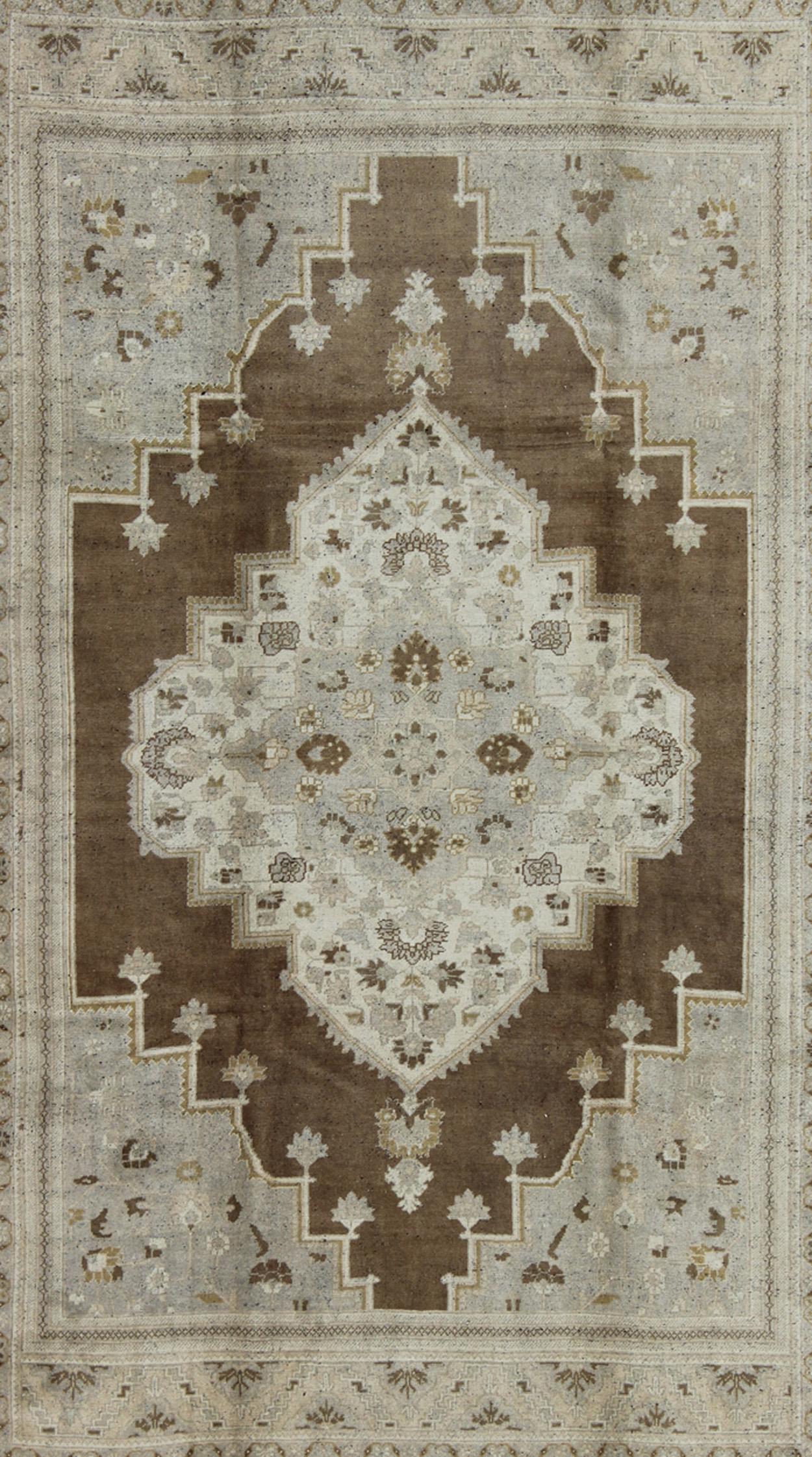 Vintage Turkish Oushak Rug in Brown Background and Neutral Colors In Good Condition For Sale In Atlanta, GA