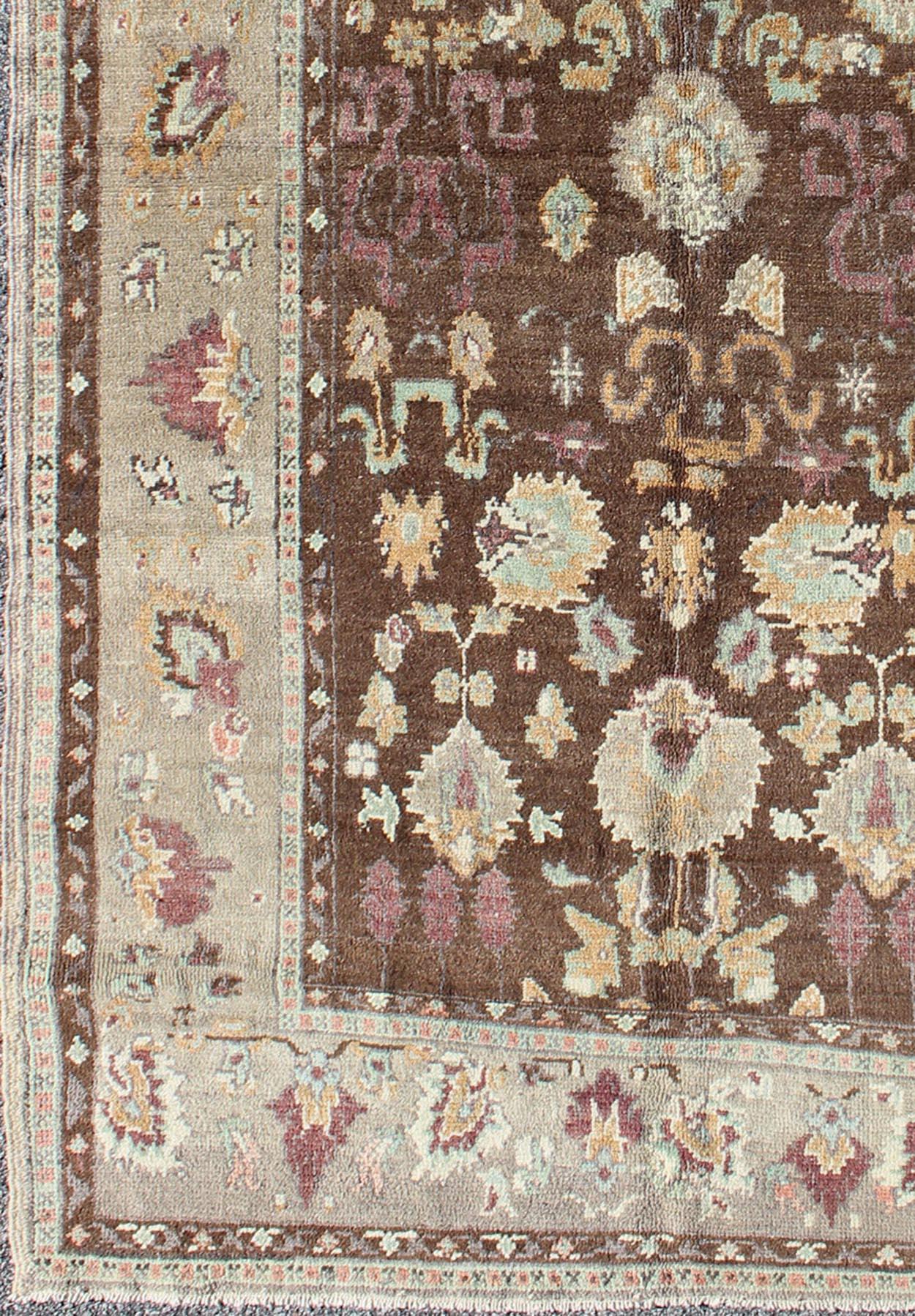 Hand-Knotted Vintage Turkish Oushak Rug in Brown Background with All-Over Floral Design For Sale