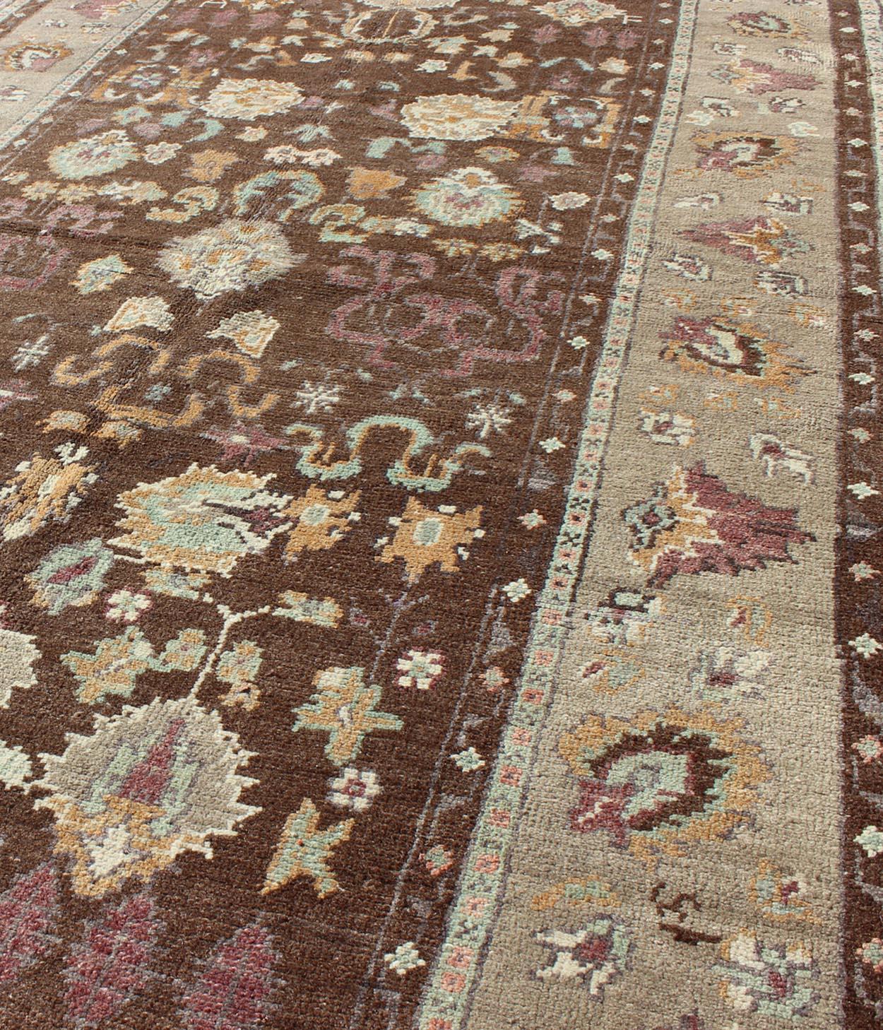 Wool Vintage Turkish Oushak Rug in Brown Background with All-Over Floral Design For Sale