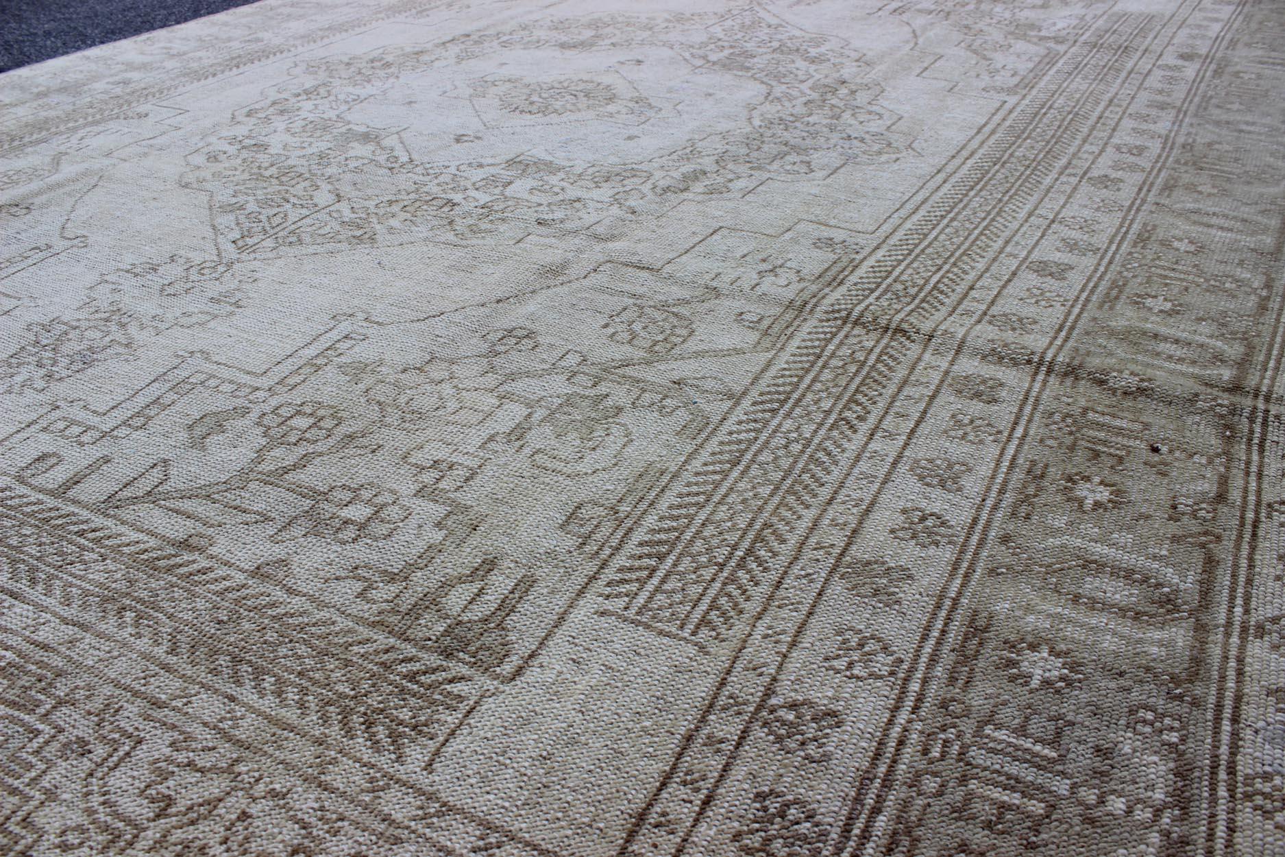 Measures: 5'11 x 9'4 
 Vintage Turkish Oushak Rug in Soft green, Ivory and light Brown Highlights. Keivan Woven Arts / Rug/EN-177, country of origin / type: Turkey / Oushak, circa 1930.

This vintage Turkish Oushak rug showcases an exquisite
