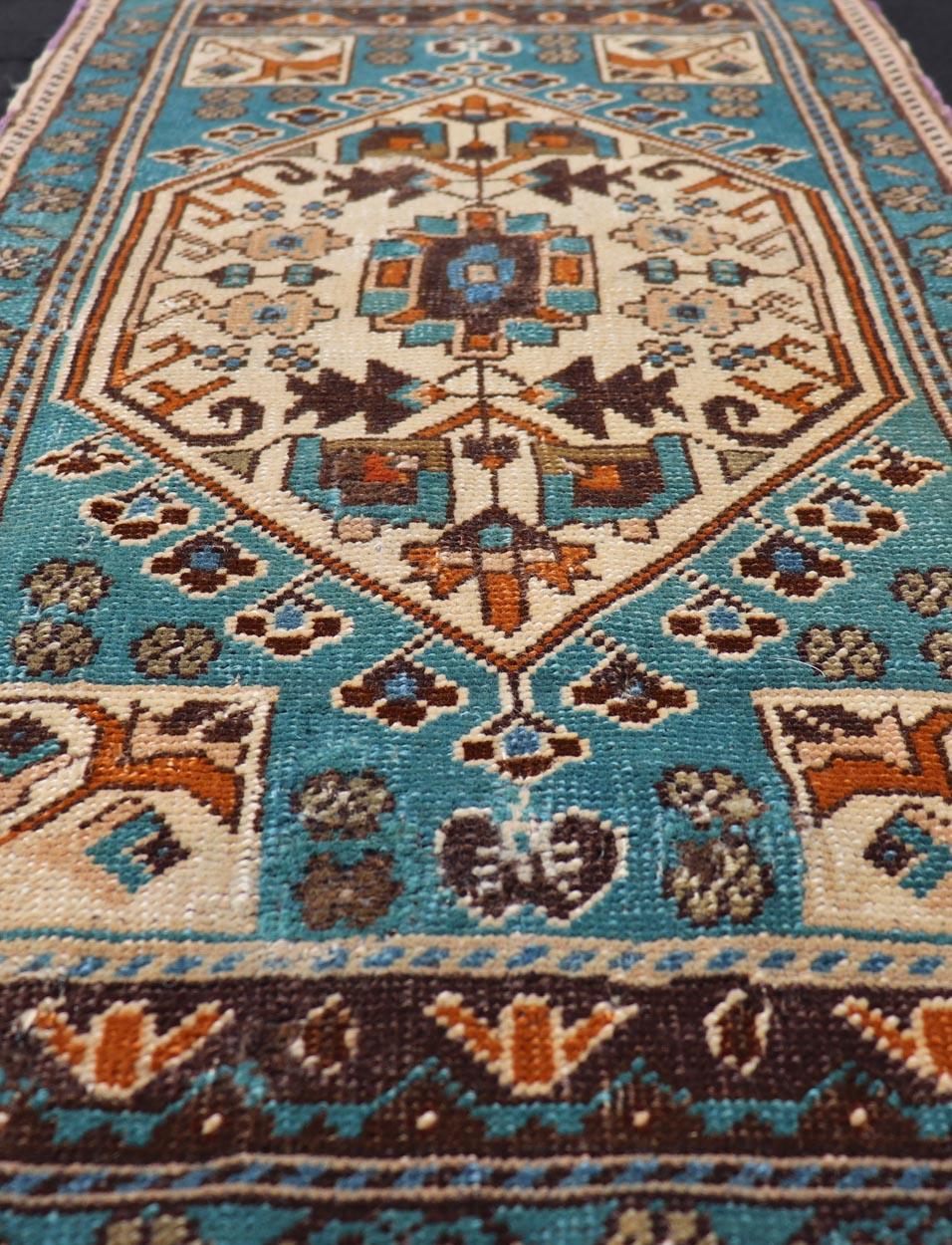 Vintage Turkish Oushak Rug in Teal Color with Geometric Medallion Design, Keivan Woven Arts / rug/ EN-15920, country of origin / type: Turkey / Oushak, circa 1950

Measures: 1'10 x 3'6 

Small Turkish small size in teal and multi colors with
