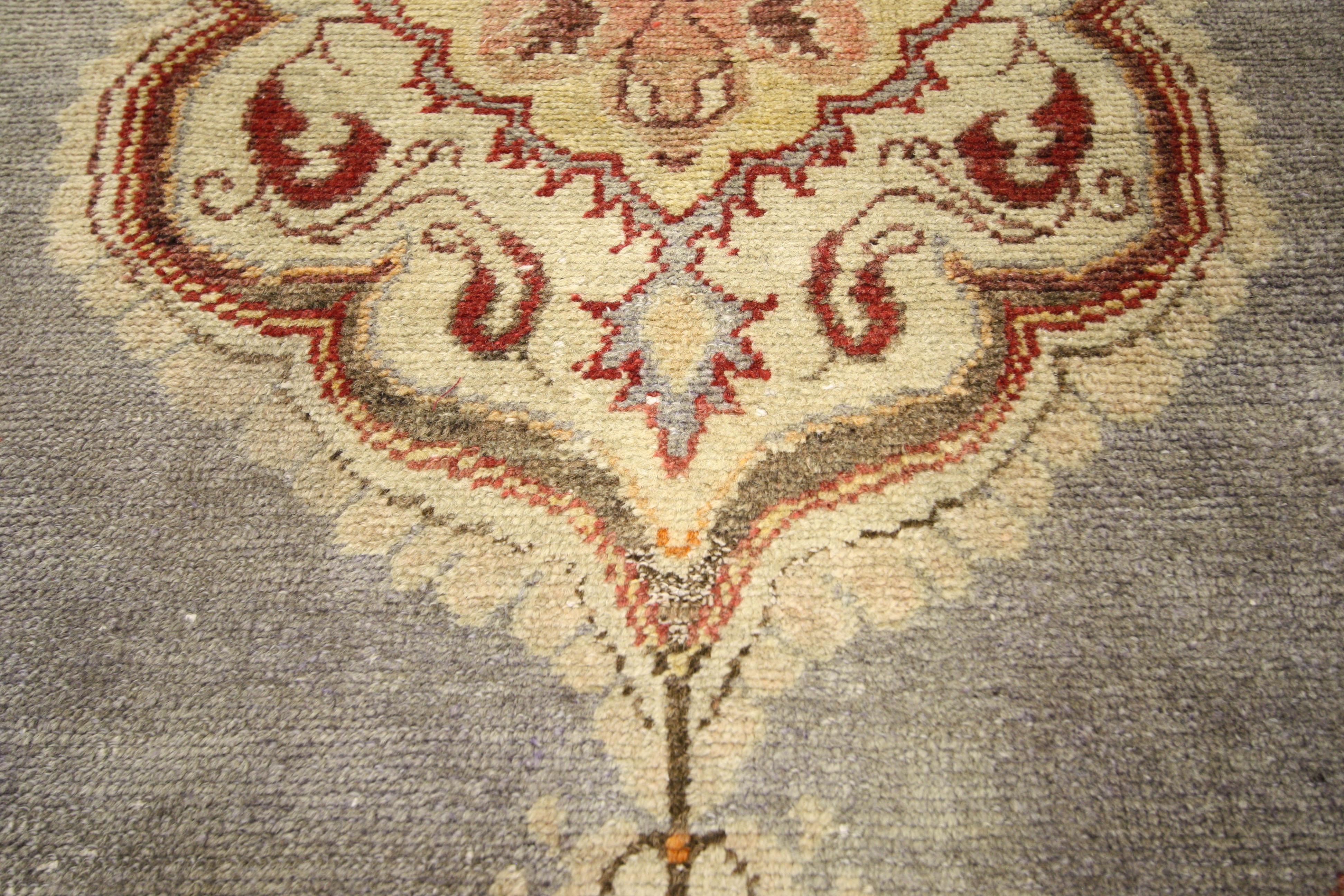 52322, vintage Turkish Oushak rug, accent rug. Emanating classic style with Jacobean flair this vintage Turkish Oushak accent rug features a lobed medallion set on an abrashed gray field with elaborate corner spandrels. Tiny outlined pendants extend