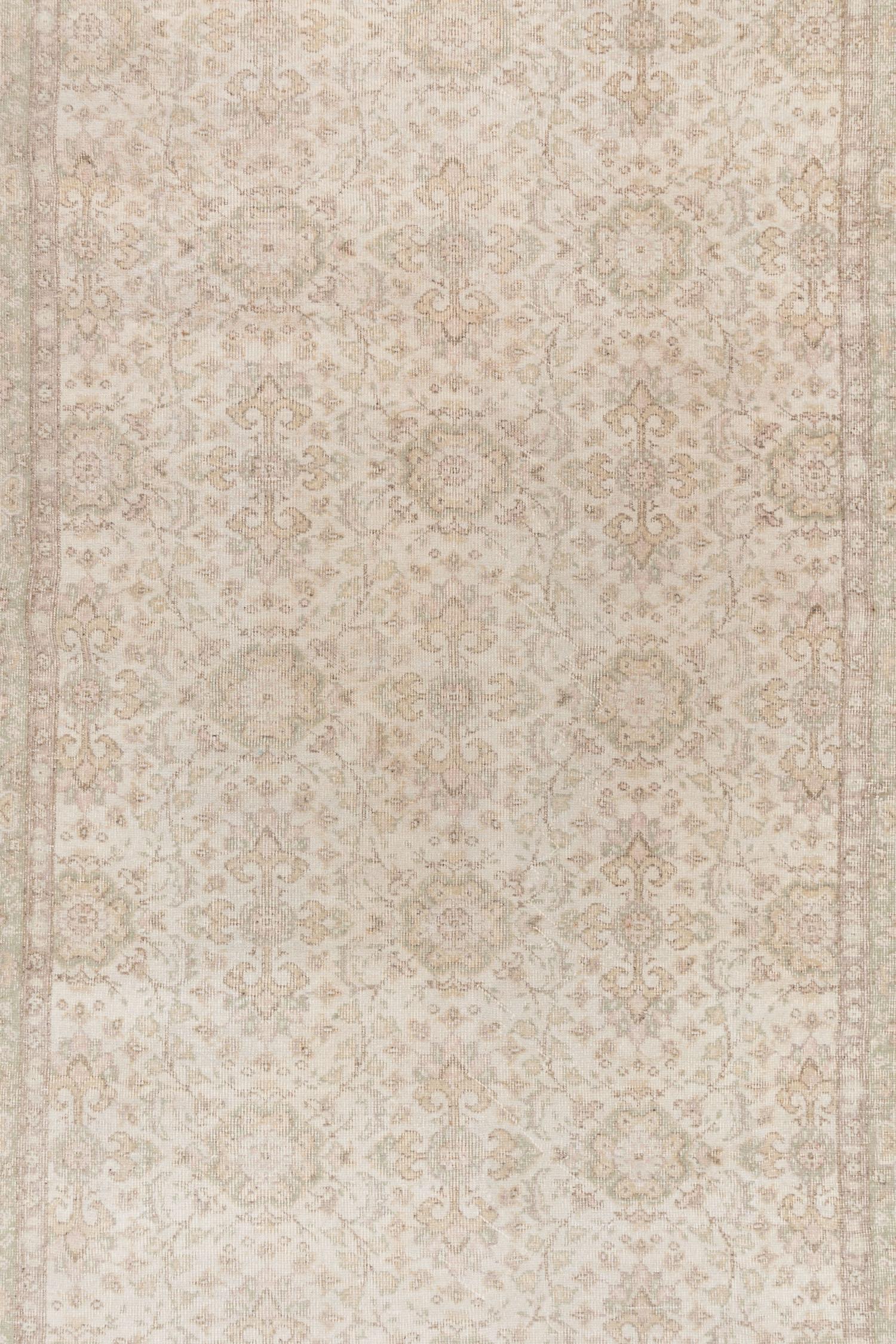 The Turkish Oushak rug is a stunning piece with a warm neutral color palette that adds a cozy and inviting touch to any space. Its subtle all-over pattern adds depth and texture without overpowering the overall design. The rug is meticulously
